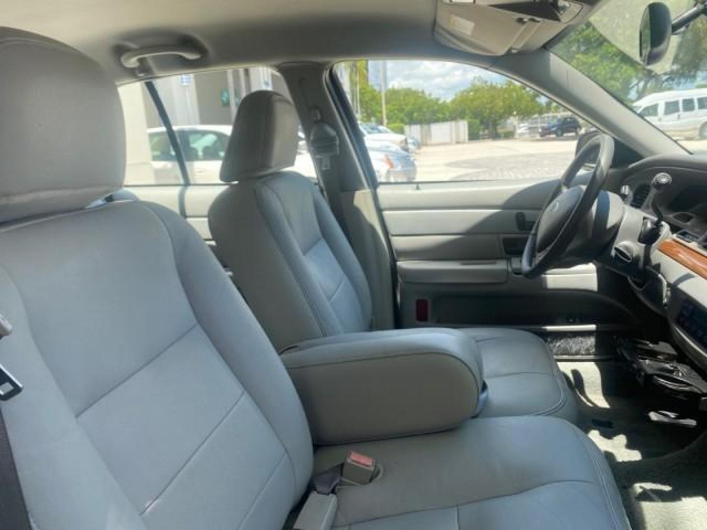 2004 Medium Titanium Metallic /Light Flint Ford Crown Victoria LX Sport LOW MILES 75,511 FL (2FAFP74W24X) with an 4.6L SEFI OHC V8 Engine engine, Automatic transmission, located at 4701 North Dixie Hwy, Pompano Beach, FL, 33064, (954) 422-2889, 26.240938, -80.123474 - OUR WEBPAGE FLORIDACARS1.COM HAS OVER 100 PHOTOS AND FREE CARFAX LINK 2004 FORD CROWN VICTORIA LX DUAL EXHAUST RARE FIND VIN: 2FAFP74W24X150704 2 F A F P 7 4 W 2 4 X 1 5 0 7 0 4 SEDAN 4 DR 4.6L V8 F GASOLINE REAR WHEEL DRIVE Top Features Alloy Wheels Leather Seats Basic Features ABS Brakes AM/FM Ste - Photo#93