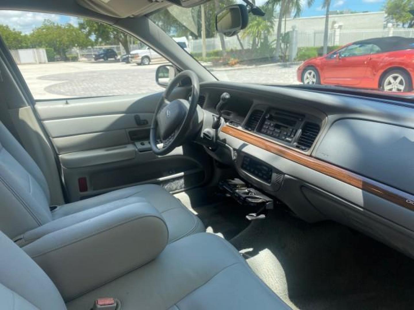 2004 Medium Titanium Metallic /Light Flint Ford Crown Victoria LX Sport LOW MILES 75,511 FL (2FAFP74W24X) with an 4.6L SEFI OHC V8 Engine engine, Automatic transmission, located at 4701 North Dixie Hwy, Pompano Beach, FL, 33064, (954) 422-2889, 26.240938, -80.123474 - OUR WEBPAGE FLORIDACARS1.COM HAS OVER 100 PHOTOS AND FREE CARFAX LINK 2004 FORD CROWN VICTORIA LX DUAL EXHAUST RARE FIND VIN: 2FAFP74W24X150704 2 F A F P 7 4 W 2 4 X 1 5 0 7 0 4 SEDAN 4 DR 4.6L V8 F GASOLINE REAR WHEEL DRIVE Top Features Alloy Wheels Leather Seats Basic Features ABS Brakes AM/FM Ste - Photo#96