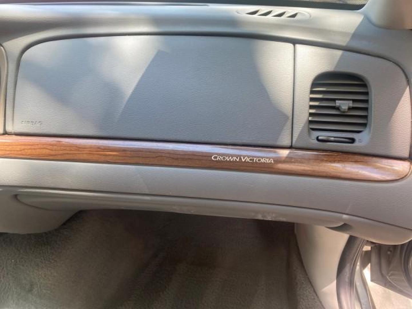 2004 Medium Titanium Metallic /Light Flint Ford Crown Victoria LX Sport LOW MILES 75,511 FL (2FAFP74W24X) with an 4.6L SEFI OHC V8 Engine engine, Automatic transmission, located at 4701 North Dixie Hwy, Pompano Beach, FL, 33064, (954) 422-2889, 26.240938, -80.123474 - OUR WEBPAGE FLORIDACARS1.COM HAS OVER 100 PHOTOS AND FREE CARFAX LINK 2004 FORD CROWN VICTORIA LX DUAL EXHAUST RARE FIND VIN: 2FAFP74W24X150704 2 F A F P 7 4 W 2 4 X 1 5 0 7 0 4 SEDAN 4 DR 4.6L V8 F GASOLINE REAR WHEEL DRIVE Top Features Alloy Wheels Leather Seats Basic Features ABS Brakes AM/FM Ste - Photo#98