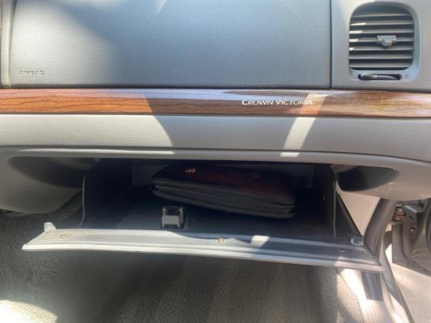 2004 Medium Titanium Metallic /Light Flint Ford Crown Victoria LX Sport LOW MILES 75,511 FL (2FAFP74W24X) with an 4.6L SEFI OHC V8 Engine engine, Automatic transmission, located at 4701 North Dixie Hwy, Pompano Beach, FL, 33064, (954) 422-2889, 26.240938, -80.123474 - OUR WEBPAGE FLORIDACARS1.COM HAS OVER 100 PHOTOS AND FREE CARFAX LINK 2004 FORD CROWN VICTORIA LX DUAL EXHAUST RARE FIND VIN: 2FAFP74W24X150704 2 F A F P 7 4 W 2 4 X 1 5 0 7 0 4 SEDAN 4 DR 4.6L V8 F GASOLINE REAR WHEEL DRIVE Top Features Alloy Wheels Leather Seats Basic Features ABS Brakes AM/FM Ste - Photo#99