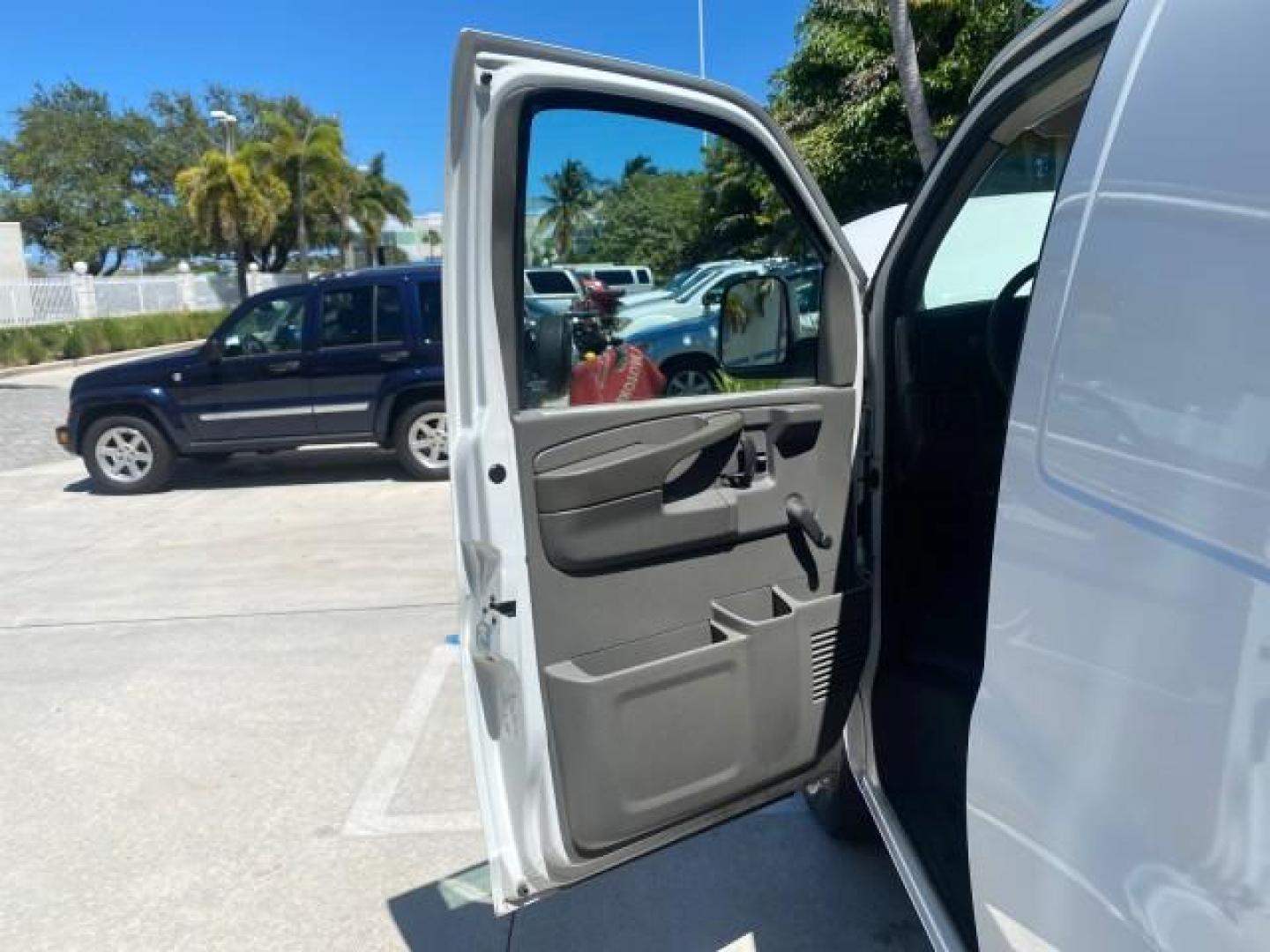 2004 Summit White /Medium Dark Pewter GMC Savana Cargo Van 1 OWNER FL (1GTFG15X141) with an 4.3L Vortec 4300 V6 MFI Engine engine, Automatic transmission, located at 4701 North Dixie Hwy, Pompano Beach, FL, 33064, (954) 422-2889, 26.240938, -80.123474 - OUR WEBPAGE FLORIDACARS1.COM HAS OVER 100 PHOTOS AND FREE CARFAX LINK 2004 GMC SAVANA 1500 THIS VAN IS LIKE NEW! VIN: 1GTFG15X141181482 1 G T F G 1 5 X 1 4 1 1 8 1 4 8 2 VAN 4.3L V6 F GASOLINE REAR WHEEL DRIVE Top Features Conversion Van Vinyl Seats Basic Features ABS Brakes AM/FM Stereo Air Conditi - Photo#9