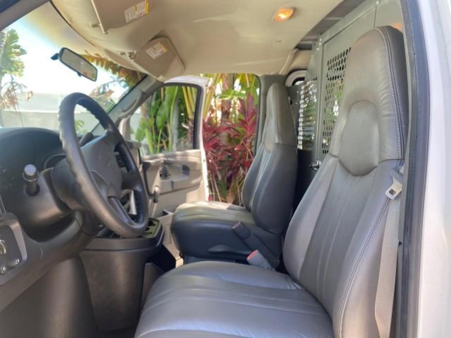 2004 Summit White /Medium Dark Pewter GMC Savana Cargo Van 1 OWNER FL (1GTFG15X141) with an 4.3L Vortec 4300 V6 MFI Engine engine, Automatic transmission, located at 4701 North Dixie Hwy, Pompano Beach, FL, 33064, (954) 422-2889, 26.240938, -80.123474 - OUR WEBPAGE FLORIDACARS1.COM HAS OVER 100 PHOTOS AND FREE CARFAX LINK 2004 GMC SAVANA 1500 THIS VAN IS LIKE NEW! VIN: 1GTFG15X141181482 1 G T F G 1 5 X 1 4 1 1 8 1 4 8 2 VAN 4.3L V6 F GASOLINE REAR WHEEL DRIVE Top Features Conversion Van Vinyl Seats Basic Features ABS Brakes AM/FM Stereo Air Conditi - Photo#10