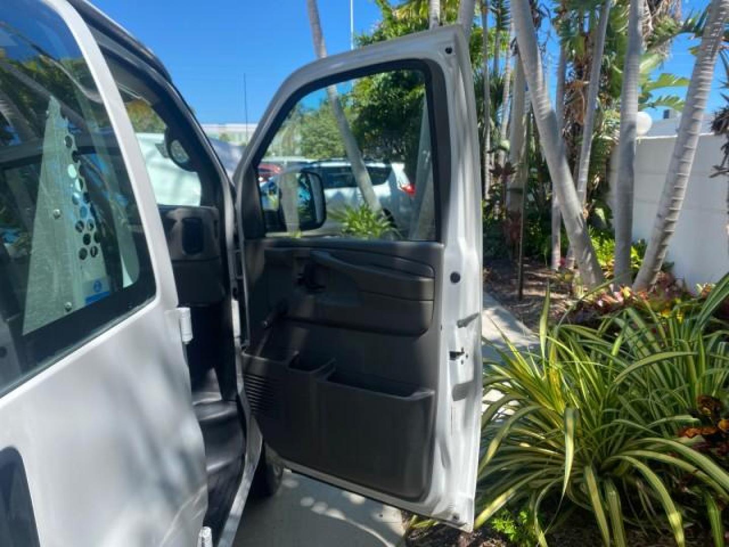 2004 Summit White /Medium Dark Pewter GMC Savana Cargo Van 1 OWNER FL (1GTFG15X141) with an 4.3L Vortec 4300 V6 MFI Engine engine, Automatic transmission, located at 4701 North Dixie Hwy, Pompano Beach, FL, 33064, (954) 422-2889, 26.240938, -80.123474 - OUR WEBPAGE FLORIDACARS1.COM HAS OVER 100 PHOTOS AND FREE CARFAX LINK 2004 GMC SAVANA 1500 THIS VAN IS LIKE NEW! VIN: 1GTFG15X141181482 1 G T F G 1 5 X 1 4 1 1 8 1 4 8 2 VAN 4.3L V6 F GASOLINE REAR WHEEL DRIVE Top Features Conversion Van Vinyl Seats Basic Features ABS Brakes AM/FM Stereo Air Conditi - Photo#11