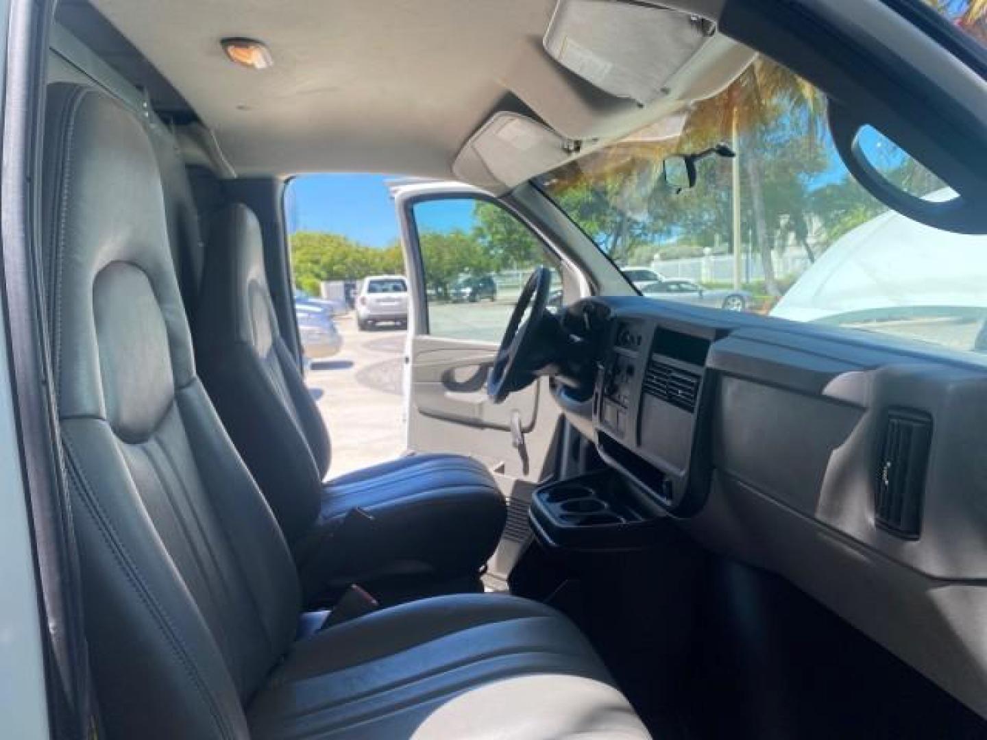 2004 Summit White /Medium Dark Pewter GMC Savana Cargo Van 1 OWNER FL (1GTFG15X141) with an 4.3L Vortec 4300 V6 MFI Engine engine, Automatic transmission, located at 4701 North Dixie Hwy, Pompano Beach, FL, 33064, (954) 422-2889, 26.240938, -80.123474 - OUR WEBPAGE FLORIDACARS1.COM HAS OVER 100 PHOTOS AND FREE CARFAX LINK 2004 GMC SAVANA 1500 THIS VAN IS LIKE NEW! VIN: 1GTFG15X141181482 1 G T F G 1 5 X 1 4 1 1 8 1 4 8 2 VAN 4.3L V6 F GASOLINE REAR WHEEL DRIVE Top Features Conversion Van Vinyl Seats Basic Features ABS Brakes AM/FM Stereo Air Conditi - Photo#12