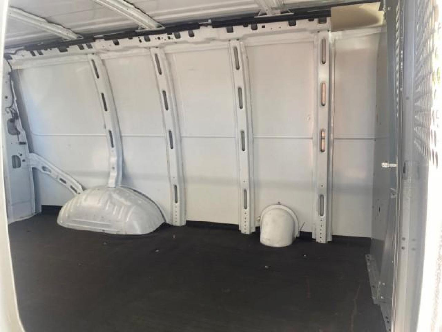 2004 Summit White /Medium Dark Pewter GMC Savana Cargo Van 1 OWNER FL (1GTFG15X141) with an 4.3L Vortec 4300 V6 MFI Engine engine, Automatic transmission, located at 4701 North Dixie Hwy, Pompano Beach, FL, 33064, (954) 422-2889, 26.240938, -80.123474 - OUR WEBPAGE FLORIDACARS1.COM HAS OVER 100 PHOTOS AND FREE CARFAX LINK 2004 GMC SAVANA 1500 THIS VAN IS LIKE NEW! VIN: 1GTFG15X141181482 1 G T F G 1 5 X 1 4 1 1 8 1 4 8 2 VAN 4.3L V6 F GASOLINE REAR WHEEL DRIVE Top Features Conversion Van Vinyl Seats Basic Features ABS Brakes AM/FM Stereo Air Conditi - Photo#14