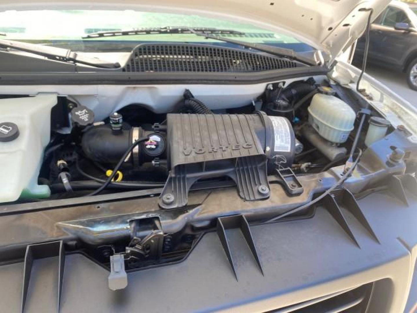 2004 Summit White /Medium Dark Pewter GMC Savana Cargo Van 1 OWNER FL (1GTFG15X141) with an 4.3L Vortec 4300 V6 MFI Engine engine, Automatic transmission, located at 4701 North Dixie Hwy, Pompano Beach, FL, 33064, (954) 422-2889, 26.240938, -80.123474 - OUR WEBPAGE FLORIDACARS1.COM HAS OVER 100 PHOTOS AND FREE CARFAX LINK 2004 GMC SAVANA 1500 THIS VAN IS LIKE NEW! VIN: 1GTFG15X141181482 1 G T F G 1 5 X 1 4 1 1 8 1 4 8 2 VAN 4.3L V6 F GASOLINE REAR WHEEL DRIVE Top Features Conversion Van Vinyl Seats Basic Features ABS Brakes AM/FM Stereo Air Conditi - Photo#26