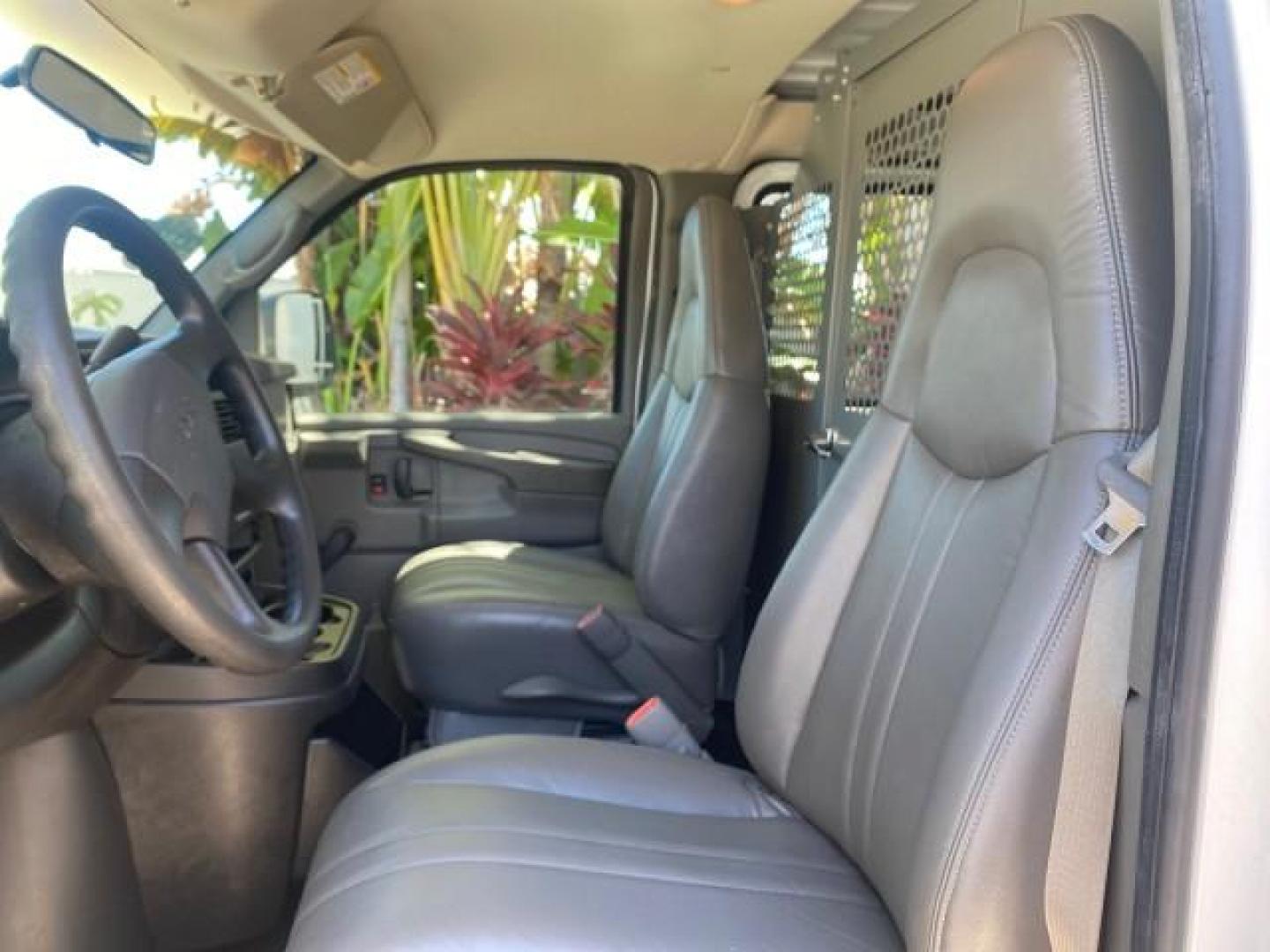 2004 Summit White /Medium Dark Pewter GMC Savana Cargo Van 1 OWNER FL (1GTFG15X141) with an 4.3L Vortec 4300 V6 MFI Engine engine, Automatic transmission, located at 4701 North Dixie Hwy, Pompano Beach, FL, 33064, (954) 422-2889, 26.240938, -80.123474 - OUR WEBPAGE FLORIDACARS1.COM HAS OVER 100 PHOTOS AND FREE CARFAX LINK 2004 GMC SAVANA 1500 THIS VAN IS LIKE NEW! VIN: 1GTFG15X141181482 1 G T F G 1 5 X 1 4 1 1 8 1 4 8 2 VAN 4.3L V6 F GASOLINE REAR WHEEL DRIVE Top Features Conversion Van Vinyl Seats Basic Features ABS Brakes AM/FM Stereo Air Conditi - Photo#32