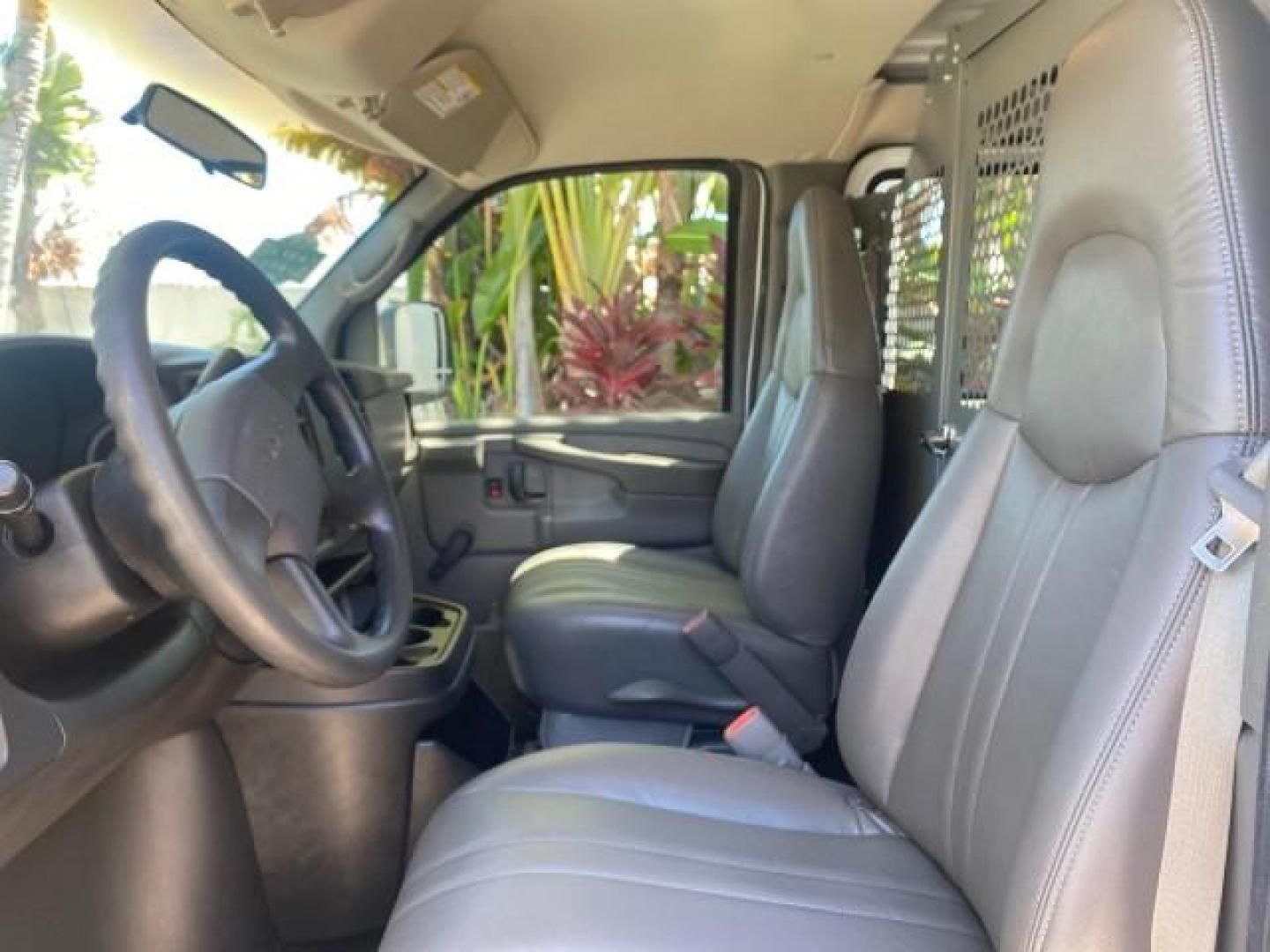2004 Summit White /Medium Dark Pewter GMC Savana Cargo Van 1 OWNER FL (1GTFG15X141) with an 4.3L Vortec 4300 V6 MFI Engine engine, Automatic transmission, located at 4701 North Dixie Hwy, Pompano Beach, FL, 33064, (954) 422-2889, 26.240938, -80.123474 - OUR WEBPAGE FLORIDACARS1.COM HAS OVER 100 PHOTOS AND FREE CARFAX LINK 2004 GMC SAVANA 1500 THIS VAN IS LIKE NEW! VIN: 1GTFG15X141181482 1 G T F G 1 5 X 1 4 1 1 8 1 4 8 2 VAN 4.3L V6 F GASOLINE REAR WHEEL DRIVE Top Features Conversion Van Vinyl Seats Basic Features ABS Brakes AM/FM Stereo Air Conditi - Photo#33