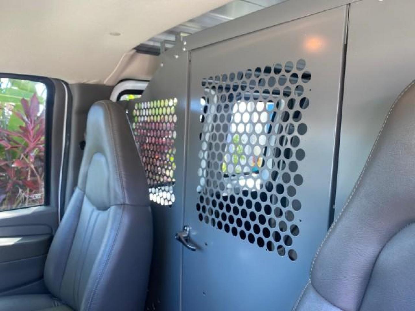 2004 Summit White /Medium Dark Pewter GMC Savana Cargo Van 1 OWNER FL (1GTFG15X141) with an 4.3L Vortec 4300 V6 MFI Engine engine, Automatic transmission, located at 4701 North Dixie Hwy, Pompano Beach, FL, 33064, (954) 422-2889, 26.240938, -80.123474 - OUR WEBPAGE FLORIDACARS1.COM HAS OVER 100 PHOTOS AND FREE CARFAX LINK 2004 GMC SAVANA 1500 THIS VAN IS LIKE NEW! VIN: 1GTFG15X141181482 1 G T F G 1 5 X 1 4 1 1 8 1 4 8 2 VAN 4.3L V6 F GASOLINE REAR WHEEL DRIVE Top Features Conversion Van Vinyl Seats Basic Features ABS Brakes AM/FM Stereo Air Conditi - Photo#54