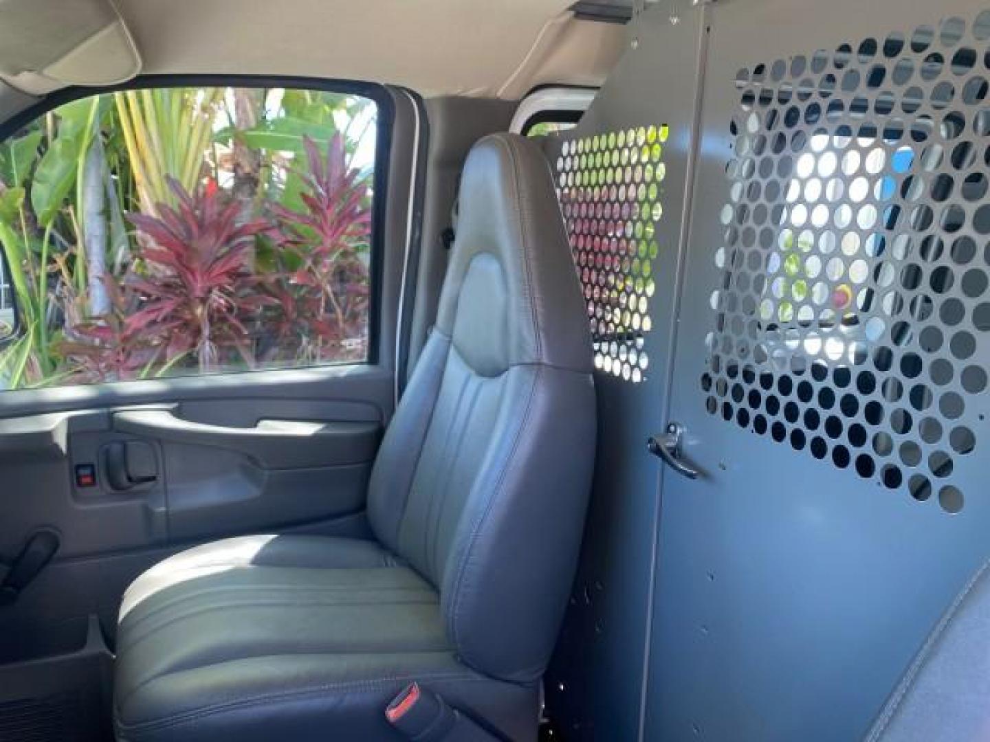 2004 Summit White /Medium Dark Pewter GMC Savana Cargo Van 1 OWNER FL (1GTFG15X141) with an 4.3L Vortec 4300 V6 MFI Engine engine, Automatic transmission, located at 4701 North Dixie Hwy, Pompano Beach, FL, 33064, (954) 422-2889, 26.240938, -80.123474 - OUR WEBPAGE FLORIDACARS1.COM HAS OVER 100 PHOTOS AND FREE CARFAX LINK 2004 GMC SAVANA 1500 THIS VAN IS LIKE NEW! VIN: 1GTFG15X141181482 1 G T F G 1 5 X 1 4 1 1 8 1 4 8 2 VAN 4.3L V6 F GASOLINE REAR WHEEL DRIVE Top Features Conversion Van Vinyl Seats Basic Features ABS Brakes AM/FM Stereo Air Conditi - Photo#55