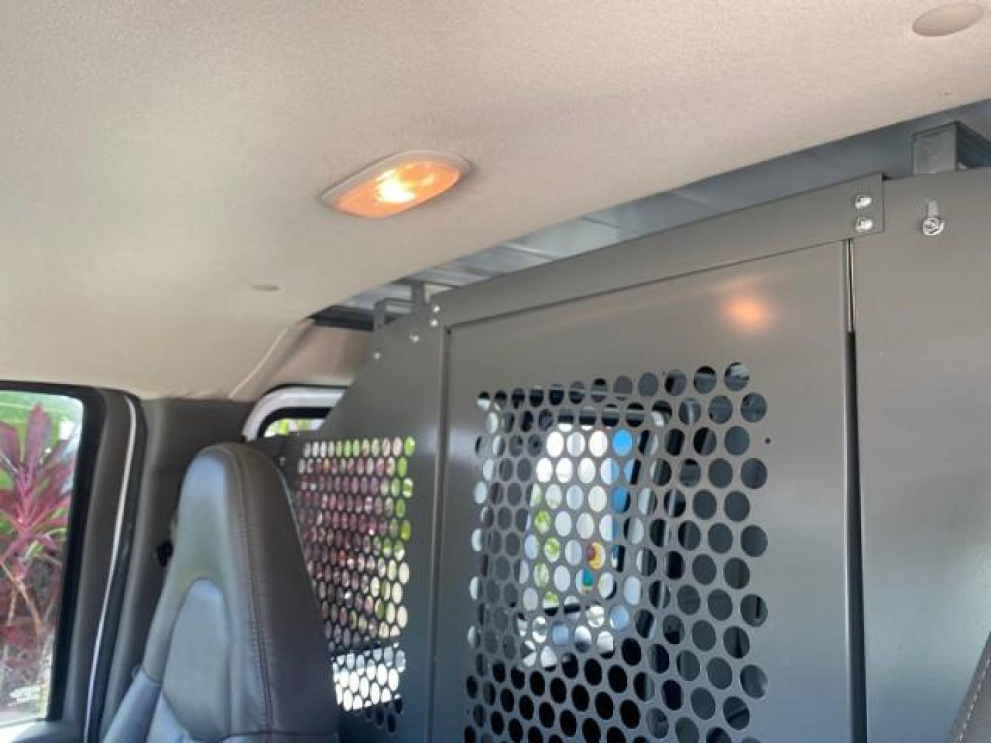 2004 Summit White /Medium Dark Pewter GMC Savana Cargo Van 1 OWNER FL (1GTFG15X141) with an 4.3L Vortec 4300 V6 MFI Engine engine, Automatic transmission, located at 4701 North Dixie Hwy, Pompano Beach, FL, 33064, (954) 422-2889, 26.240938, -80.123474 - OUR WEBPAGE FLORIDACARS1.COM HAS OVER 100 PHOTOS AND FREE CARFAX LINK 2004 GMC SAVANA 1500 THIS VAN IS LIKE NEW! VIN: 1GTFG15X141181482 1 G T F G 1 5 X 1 4 1 1 8 1 4 8 2 VAN 4.3L V6 F GASOLINE REAR WHEEL DRIVE Top Features Conversion Van Vinyl Seats Basic Features ABS Brakes AM/FM Stereo Air Conditi - Photo#56