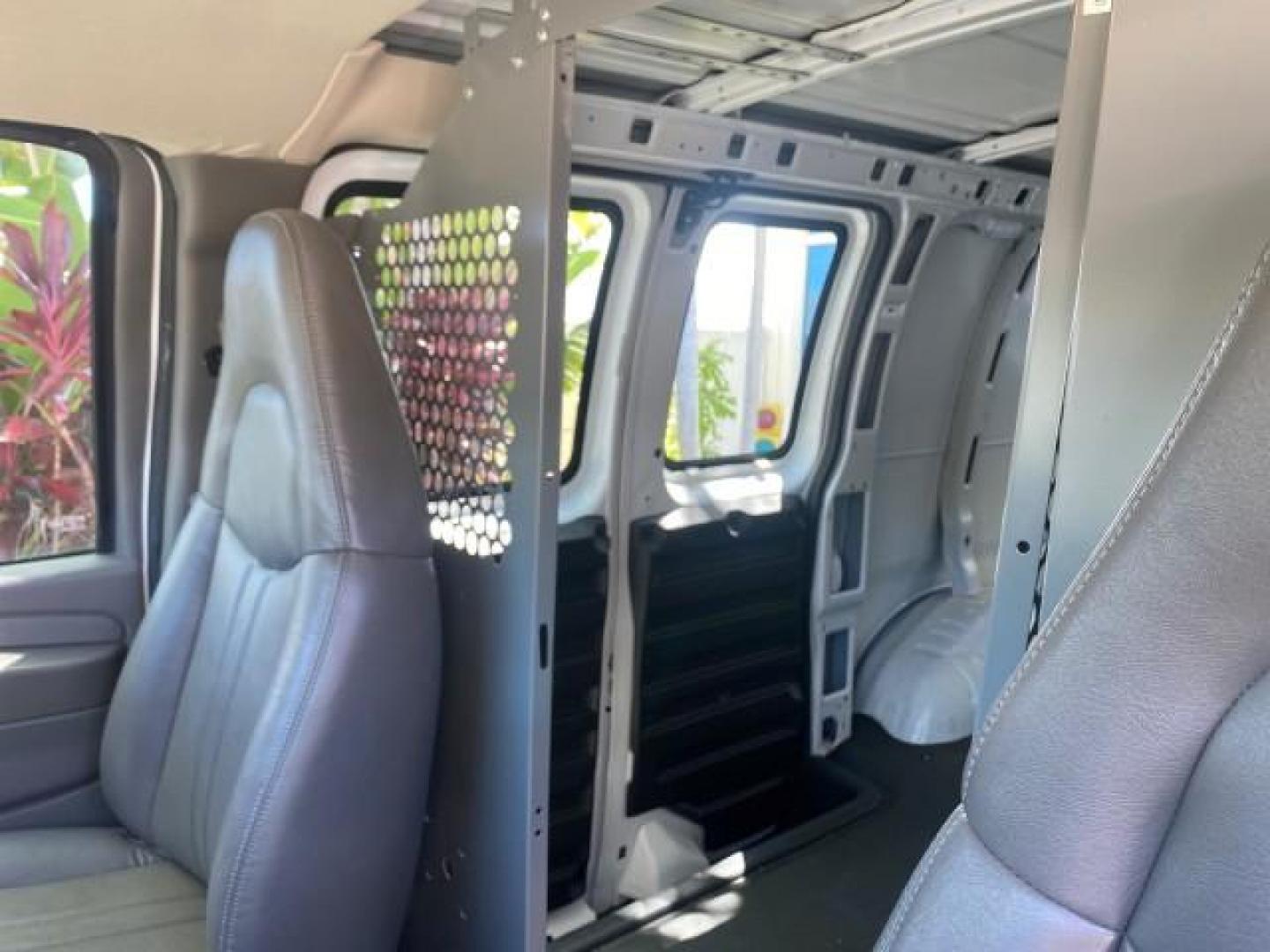 2004 Summit White /Medium Dark Pewter GMC Savana Cargo Van 1 OWNER FL (1GTFG15X141) with an 4.3L Vortec 4300 V6 MFI Engine engine, Automatic transmission, located at 4701 North Dixie Hwy, Pompano Beach, FL, 33064, (954) 422-2889, 26.240938, -80.123474 - OUR WEBPAGE FLORIDACARS1.COM HAS OVER 100 PHOTOS AND FREE CARFAX LINK 2004 GMC SAVANA 1500 THIS VAN IS LIKE NEW! VIN: 1GTFG15X141181482 1 G T F G 1 5 X 1 4 1 1 8 1 4 8 2 VAN 4.3L V6 F GASOLINE REAR WHEEL DRIVE Top Features Conversion Van Vinyl Seats Basic Features ABS Brakes AM/FM Stereo Air Conditi - Photo#57