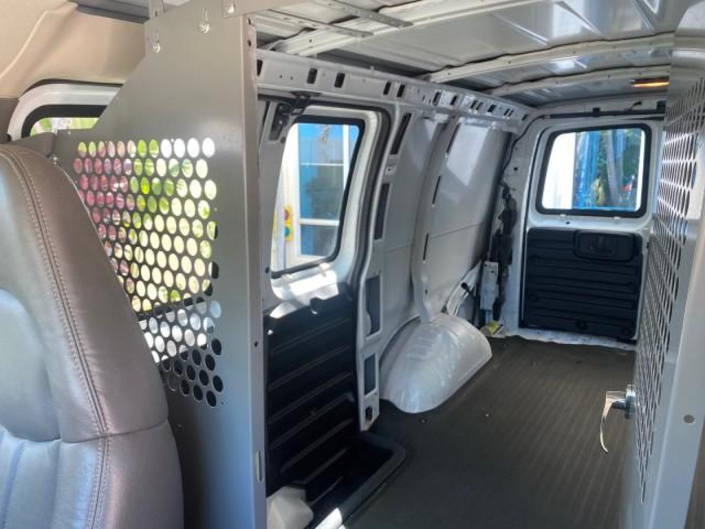 2004 Summit White /Medium Dark Pewter GMC Savana Cargo Van 1 OWNER FL (1GTFG15X141) with an 4.3L Vortec 4300 V6 MFI Engine engine, Automatic transmission, located at 4701 North Dixie Hwy, Pompano Beach, FL, 33064, (954) 422-2889, 26.240938, -80.123474 - OUR WEBPAGE FLORIDACARS1.COM HAS OVER 100 PHOTOS AND FREE CARFAX LINK 2004 GMC SAVANA 1500 THIS VAN IS LIKE NEW! VIN: 1GTFG15X141181482 1 G T F G 1 5 X 1 4 1 1 8 1 4 8 2 VAN 4.3L V6 F GASOLINE REAR WHEEL DRIVE Top Features Conversion Van Vinyl Seats Basic Features ABS Brakes AM/FM Stereo Air Conditi - Photo#58