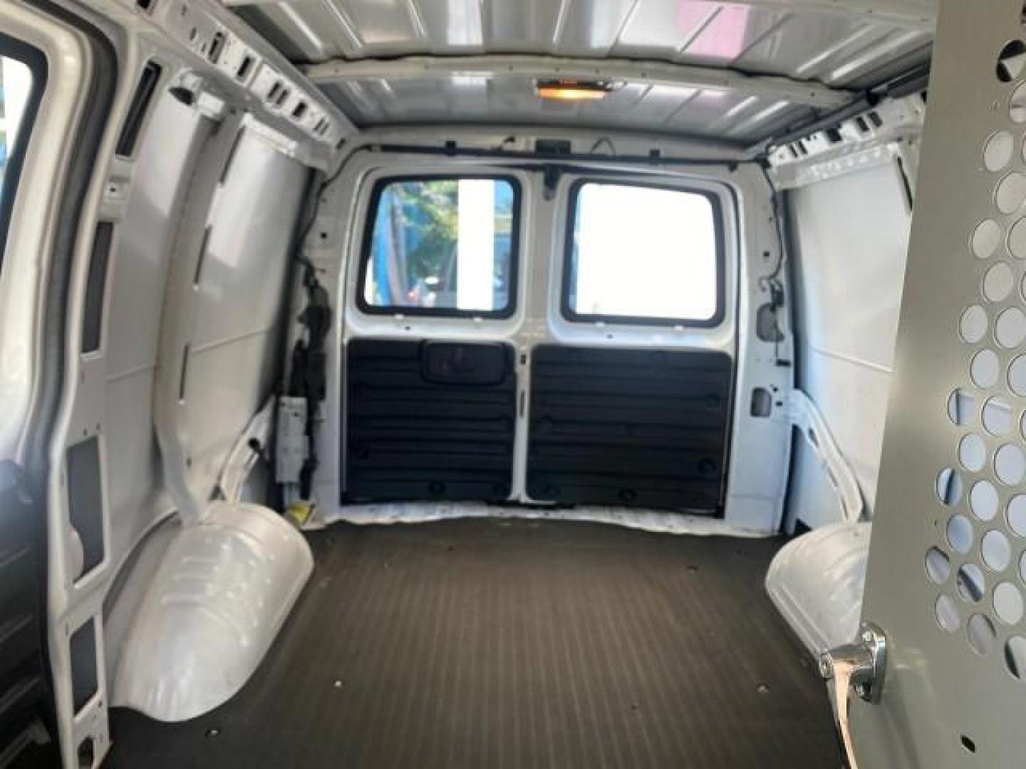 2004 Summit White /Medium Dark Pewter GMC Savana Cargo Van 1 OWNER FL (1GTFG15X141) with an 4.3L Vortec 4300 V6 MFI Engine engine, Automatic transmission, located at 4701 North Dixie Hwy, Pompano Beach, FL, 33064, (954) 422-2889, 26.240938, -80.123474 - OUR WEBPAGE FLORIDACARS1.COM HAS OVER 100 PHOTOS AND FREE CARFAX LINK 2004 GMC SAVANA 1500 THIS VAN IS LIKE NEW! VIN: 1GTFG15X141181482 1 G T F G 1 5 X 1 4 1 1 8 1 4 8 2 VAN 4.3L V6 F GASOLINE REAR WHEEL DRIVE Top Features Conversion Van Vinyl Seats Basic Features ABS Brakes AM/FM Stereo Air Conditi - Photo#60