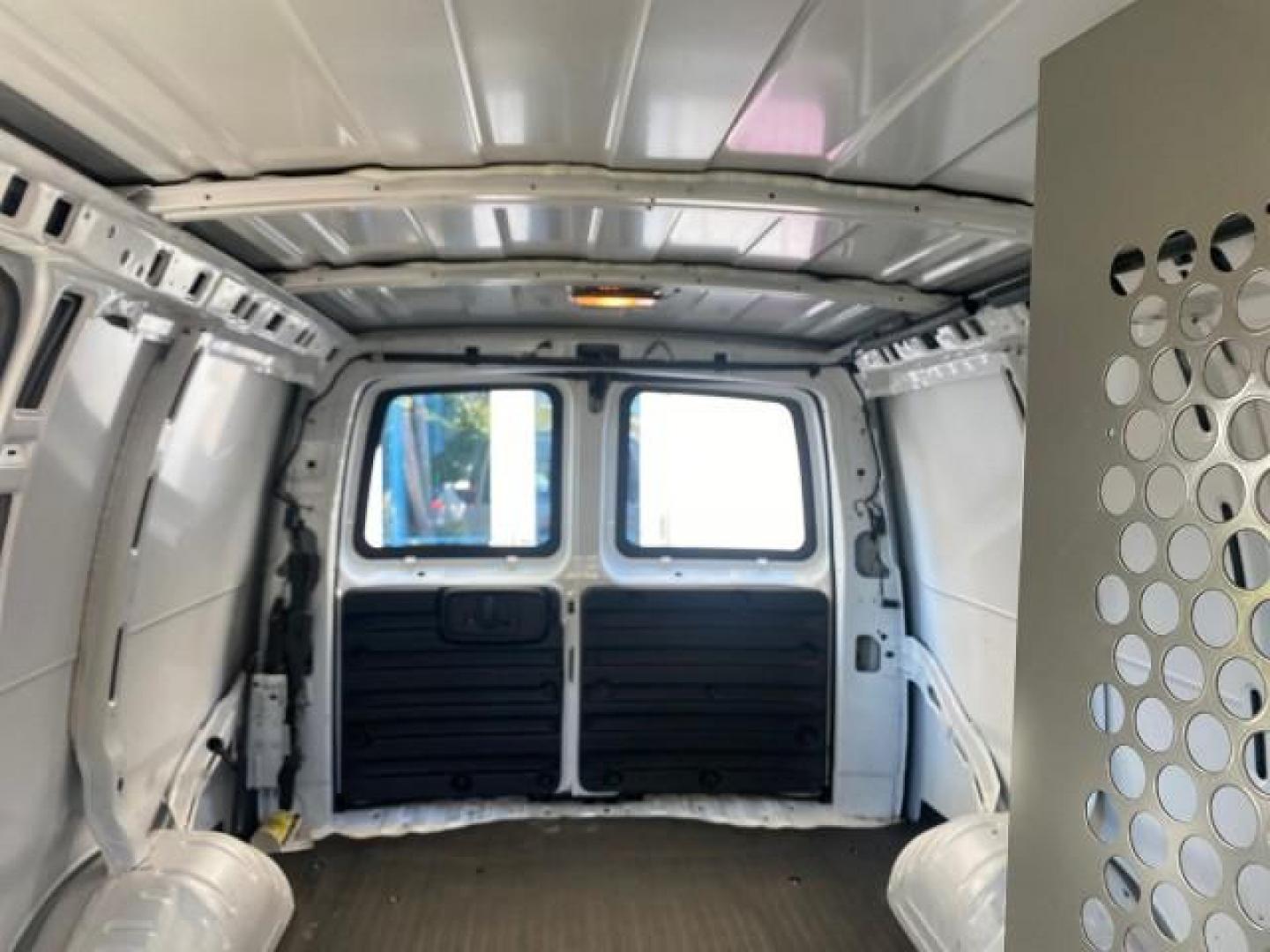 2004 Summit White /Medium Dark Pewter GMC Savana Cargo Van 1 OWNER FL (1GTFG15X141) with an 4.3L Vortec 4300 V6 MFI Engine engine, Automatic transmission, located at 4701 North Dixie Hwy, Pompano Beach, FL, 33064, (954) 422-2889, 26.240938, -80.123474 - OUR WEBPAGE FLORIDACARS1.COM HAS OVER 100 PHOTOS AND FREE CARFAX LINK 2004 GMC SAVANA 1500 THIS VAN IS LIKE NEW! VIN: 1GTFG15X141181482 1 G T F G 1 5 X 1 4 1 1 8 1 4 8 2 VAN 4.3L V6 F GASOLINE REAR WHEEL DRIVE Top Features Conversion Van Vinyl Seats Basic Features ABS Brakes AM/FM Stereo Air Conditi - Photo#61