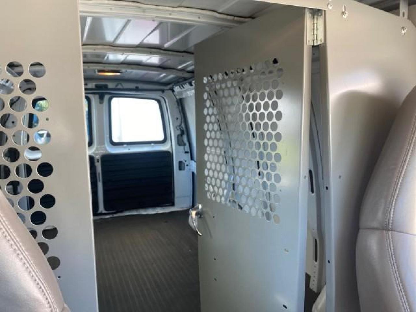 2004 Summit White /Medium Dark Pewter GMC Savana Cargo Van 1 OWNER FL (1GTFG15X141) with an 4.3L Vortec 4300 V6 MFI Engine engine, Automatic transmission, located at 4701 North Dixie Hwy, Pompano Beach, FL, 33064, (954) 422-2889, 26.240938, -80.123474 - OUR WEBPAGE FLORIDACARS1.COM HAS OVER 100 PHOTOS AND FREE CARFAX LINK 2004 GMC SAVANA 1500 THIS VAN IS LIKE NEW! VIN: 1GTFG15X141181482 1 G T F G 1 5 X 1 4 1 1 8 1 4 8 2 VAN 4.3L V6 F GASOLINE REAR WHEEL DRIVE Top Features Conversion Van Vinyl Seats Basic Features ABS Brakes AM/FM Stereo Air Conditi - Photo#62