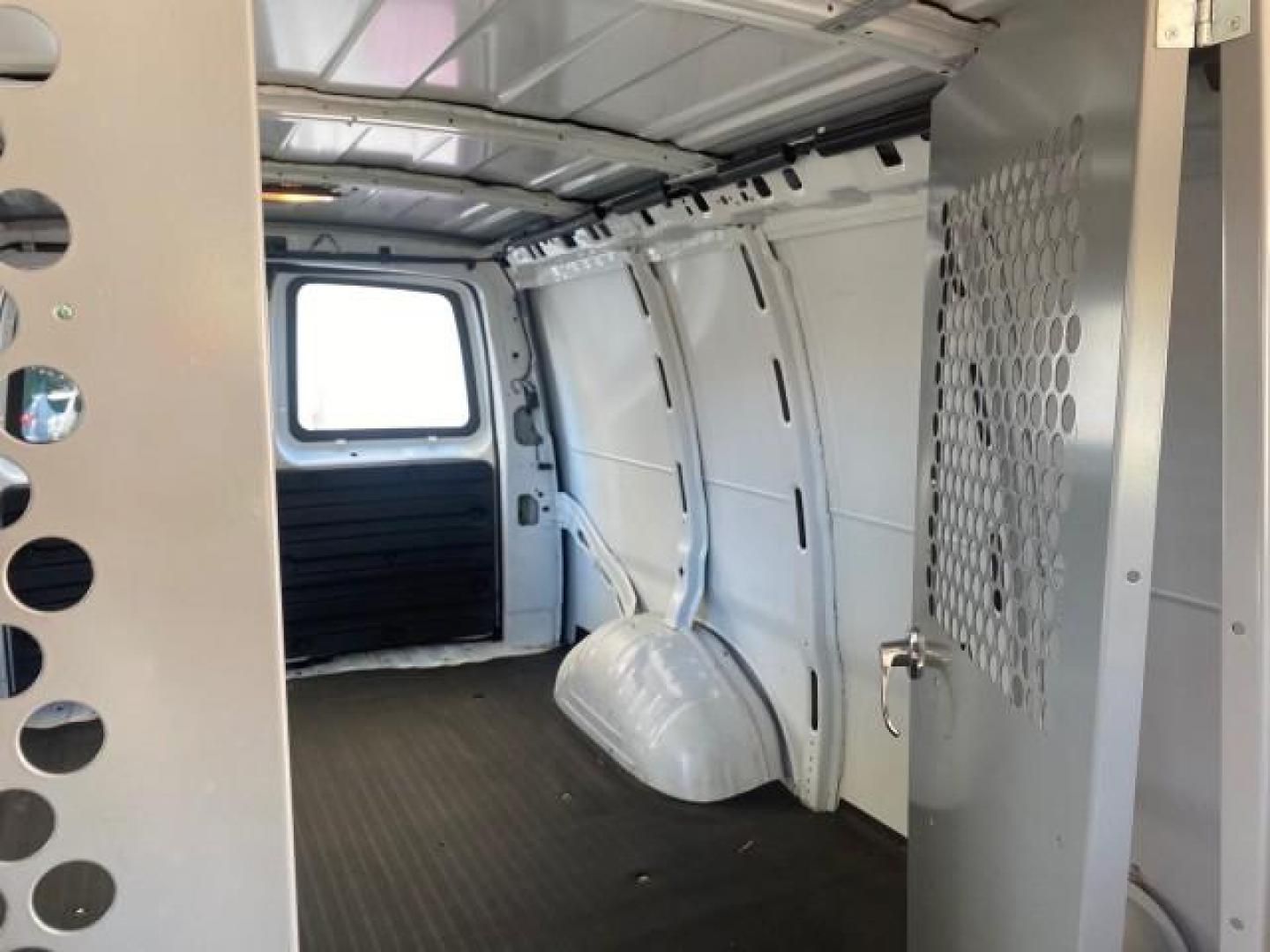 2004 Summit White /Medium Dark Pewter GMC Savana Cargo Van 1 OWNER FL (1GTFG15X141) with an 4.3L Vortec 4300 V6 MFI Engine engine, Automatic transmission, located at 4701 North Dixie Hwy, Pompano Beach, FL, 33064, (954) 422-2889, 26.240938, -80.123474 - OUR WEBPAGE FLORIDACARS1.COM HAS OVER 100 PHOTOS AND FREE CARFAX LINK 2004 GMC SAVANA 1500 THIS VAN IS LIKE NEW! VIN: 1GTFG15X141181482 1 G T F G 1 5 X 1 4 1 1 8 1 4 8 2 VAN 4.3L V6 F GASOLINE REAR WHEEL DRIVE Top Features Conversion Van Vinyl Seats Basic Features ABS Brakes AM/FM Stereo Air Conditi - Photo#63