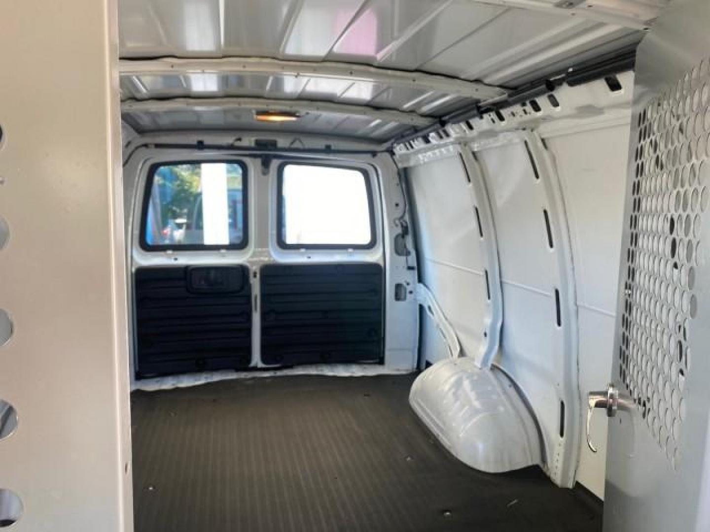 2004 Summit White /Medium Dark Pewter GMC Savana Cargo Van 1 OWNER FL (1GTFG15X141) with an 4.3L Vortec 4300 V6 MFI Engine engine, Automatic transmission, located at 4701 North Dixie Hwy, Pompano Beach, FL, 33064, (954) 422-2889, 26.240938, -80.123474 - OUR WEBPAGE FLORIDACARS1.COM HAS OVER 100 PHOTOS AND FREE CARFAX LINK 2004 GMC SAVANA 1500 THIS VAN IS LIKE NEW! VIN: 1GTFG15X141181482 1 G T F G 1 5 X 1 4 1 1 8 1 4 8 2 VAN 4.3L V6 F GASOLINE REAR WHEEL DRIVE Top Features Conversion Van Vinyl Seats Basic Features ABS Brakes AM/FM Stereo Air Conditi - Photo#64