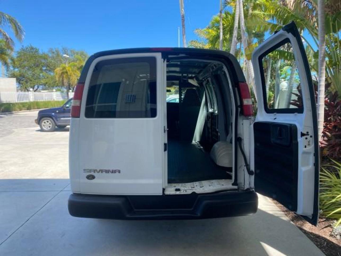 2004 Summit White /Medium Dark Pewter GMC Savana Cargo Van 1 OWNER FL (1GTFG15X141) with an 4.3L Vortec 4300 V6 MFI Engine engine, Automatic transmission, located at 4701 North Dixie Hwy, Pompano Beach, FL, 33064, (954) 422-2889, 26.240938, -80.123474 - OUR WEBPAGE FLORIDACARS1.COM HAS OVER 100 PHOTOS AND FREE CARFAX LINK 2004 GMC SAVANA 1500 THIS VAN IS LIKE NEW! VIN: 1GTFG15X141181482 1 G T F G 1 5 X 1 4 1 1 8 1 4 8 2 VAN 4.3L V6 F GASOLINE REAR WHEEL DRIVE Top Features Conversion Van Vinyl Seats Basic Features ABS Brakes AM/FM Stereo Air Conditi - Photo#75