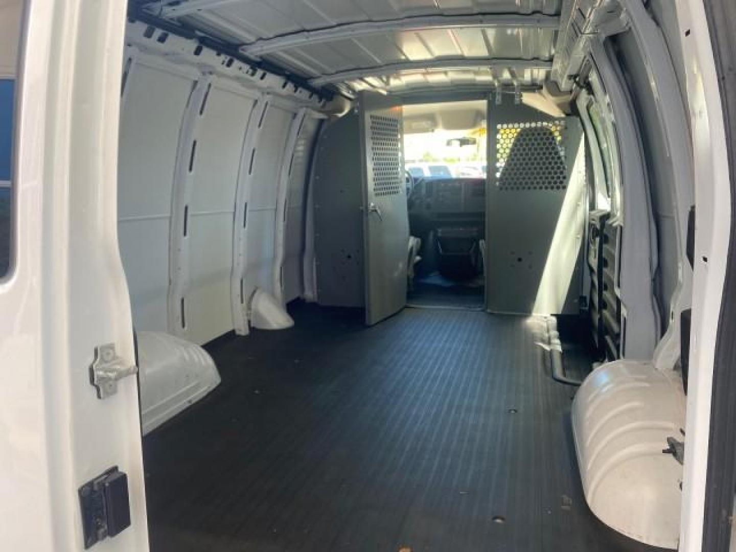 2004 Summit White /Medium Dark Pewter GMC Savana Cargo Van 1 OWNER FL (1GTFG15X141) with an 4.3L Vortec 4300 V6 MFI Engine engine, Automatic transmission, located at 4701 North Dixie Hwy, Pompano Beach, FL, 33064, (954) 422-2889, 26.240938, -80.123474 - OUR WEBPAGE FLORIDACARS1.COM HAS OVER 100 PHOTOS AND FREE CARFAX LINK 2004 GMC SAVANA 1500 THIS VAN IS LIKE NEW! VIN: 1GTFG15X141181482 1 G T F G 1 5 X 1 4 1 1 8 1 4 8 2 VAN 4.3L V6 F GASOLINE REAR WHEEL DRIVE Top Features Conversion Van Vinyl Seats Basic Features ABS Brakes AM/FM Stereo Air Conditi - Photo#77