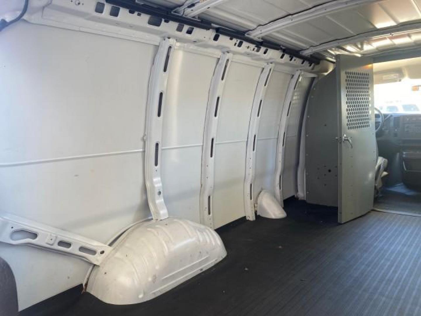 2004 Summit White /Medium Dark Pewter GMC Savana Cargo Van 1 OWNER FL (1GTFG15X141) with an 4.3L Vortec 4300 V6 MFI Engine engine, Automatic transmission, located at 4701 North Dixie Hwy, Pompano Beach, FL, 33064, (954) 422-2889, 26.240938, -80.123474 - OUR WEBPAGE FLORIDACARS1.COM HAS OVER 100 PHOTOS AND FREE CARFAX LINK 2004 GMC SAVANA 1500 THIS VAN IS LIKE NEW! VIN: 1GTFG15X141181482 1 G T F G 1 5 X 1 4 1 1 8 1 4 8 2 VAN 4.3L V6 F GASOLINE REAR WHEEL DRIVE Top Features Conversion Van Vinyl Seats Basic Features ABS Brakes AM/FM Stereo Air Conditi - Photo#78