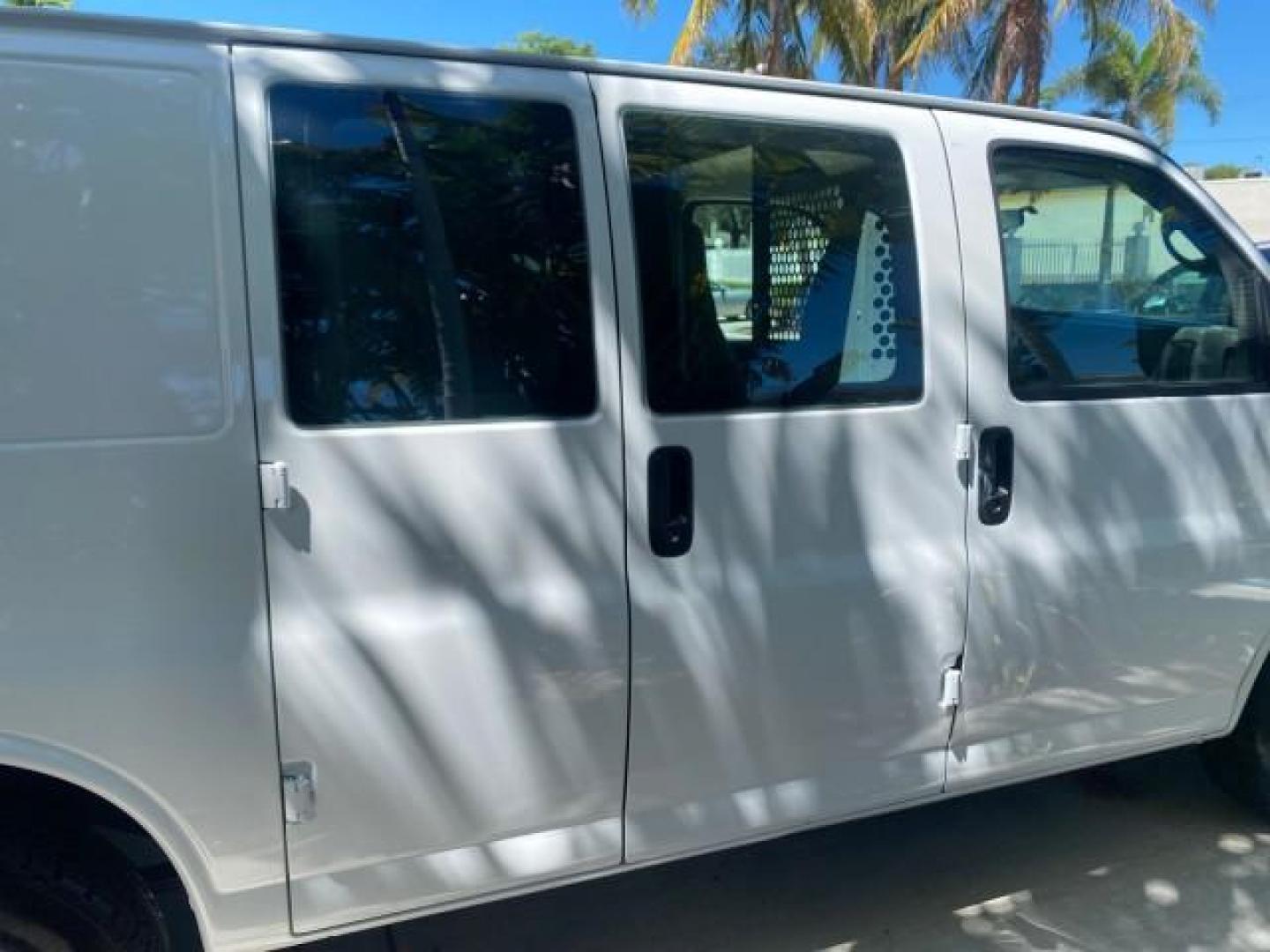 2004 Summit White /Medium Dark Pewter GMC Savana Cargo Van 1 OWNER FL (1GTFG15X141) with an 4.3L Vortec 4300 V6 MFI Engine engine, Automatic transmission, located at 4701 North Dixie Hwy, Pompano Beach, FL, 33064, (954) 422-2889, 26.240938, -80.123474 - OUR WEBPAGE FLORIDACARS1.COM HAS OVER 100 PHOTOS AND FREE CARFAX LINK 2004 GMC SAVANA 1500 THIS VAN IS LIKE NEW! VIN: 1GTFG15X141181482 1 G T F G 1 5 X 1 4 1 1 8 1 4 8 2 VAN 4.3L V6 F GASOLINE REAR WHEEL DRIVE Top Features Conversion Van Vinyl Seats Basic Features ABS Brakes AM/FM Stereo Air Conditi - Photo#85