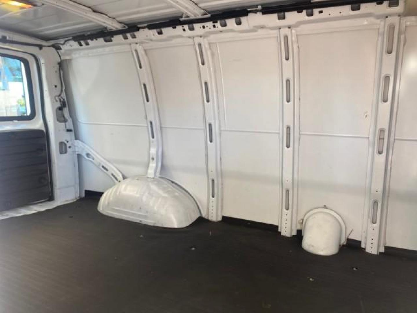 2004 Summit White /Medium Dark Pewter GMC Savana Cargo Van 1 OWNER FL (1GTFG15X141) with an 4.3L Vortec 4300 V6 MFI Engine engine, Automatic transmission, located at 4701 North Dixie Hwy, Pompano Beach, FL, 33064, (954) 422-2889, 26.240938, -80.123474 - OUR WEBPAGE FLORIDACARS1.COM HAS OVER 100 PHOTOS AND FREE CARFAX LINK 2004 GMC SAVANA 1500 THIS VAN IS LIKE NEW! VIN: 1GTFG15X141181482 1 G T F G 1 5 X 1 4 1 1 8 1 4 8 2 VAN 4.3L V6 F GASOLINE REAR WHEEL DRIVE Top Features Conversion Van Vinyl Seats Basic Features ABS Brakes AM/FM Stereo Air Conditi - Photo#92