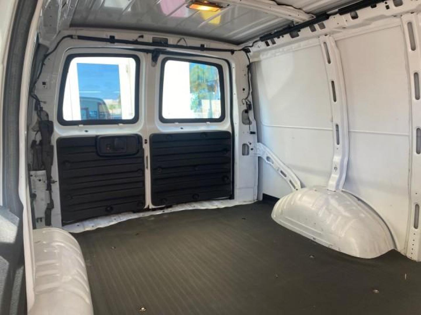 2004 Summit White /Medium Dark Pewter GMC Savana Cargo Van 1 OWNER FL (1GTFG15X141) with an 4.3L Vortec 4300 V6 MFI Engine engine, Automatic transmission, located at 4701 North Dixie Hwy, Pompano Beach, FL, 33064, (954) 422-2889, 26.240938, -80.123474 - OUR WEBPAGE FLORIDACARS1.COM HAS OVER 100 PHOTOS AND FREE CARFAX LINK 2004 GMC SAVANA 1500 THIS VAN IS LIKE NEW! VIN: 1GTFG15X141181482 1 G T F G 1 5 X 1 4 1 1 8 1 4 8 2 VAN 4.3L V6 F GASOLINE REAR WHEEL DRIVE Top Features Conversion Van Vinyl Seats Basic Features ABS Brakes AM/FM Stereo Air Conditi - Photo#93
