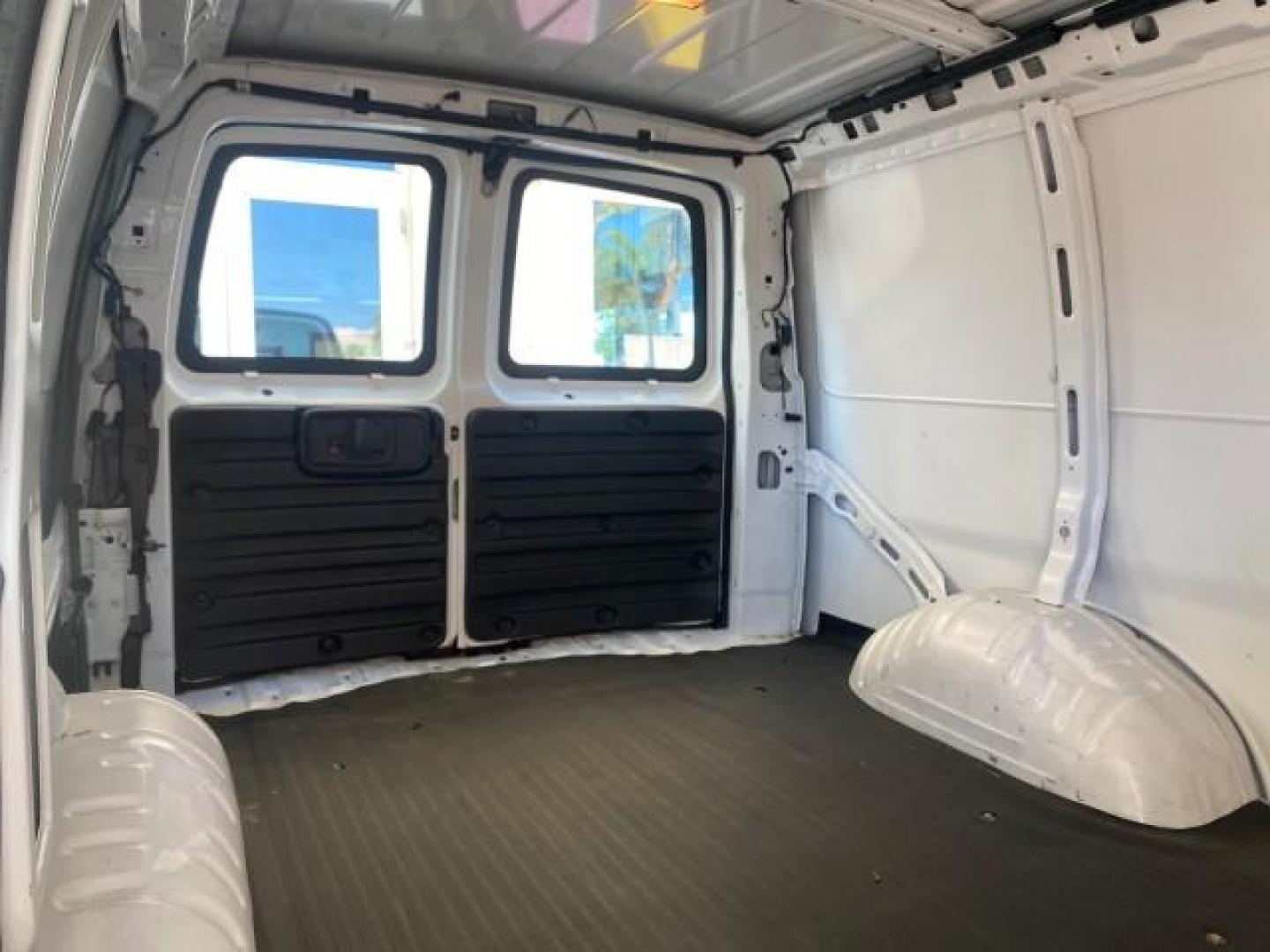 2004 Summit White /Medium Dark Pewter GMC Savana Cargo Van 1 OWNER FL (1GTFG15X141) with an 4.3L Vortec 4300 V6 MFI Engine engine, Automatic transmission, located at 4701 North Dixie Hwy, Pompano Beach, FL, 33064, (954) 422-2889, 26.240938, -80.123474 - OUR WEBPAGE FLORIDACARS1.COM HAS OVER 100 PHOTOS AND FREE CARFAX LINK 2004 GMC SAVANA 1500 THIS VAN IS LIKE NEW! VIN: 1GTFG15X141181482 1 G T F G 1 5 X 1 4 1 1 8 1 4 8 2 VAN 4.3L V6 F GASOLINE REAR WHEEL DRIVE Top Features Conversion Van Vinyl Seats Basic Features ABS Brakes AM/FM Stereo Air Conditi - Photo#94