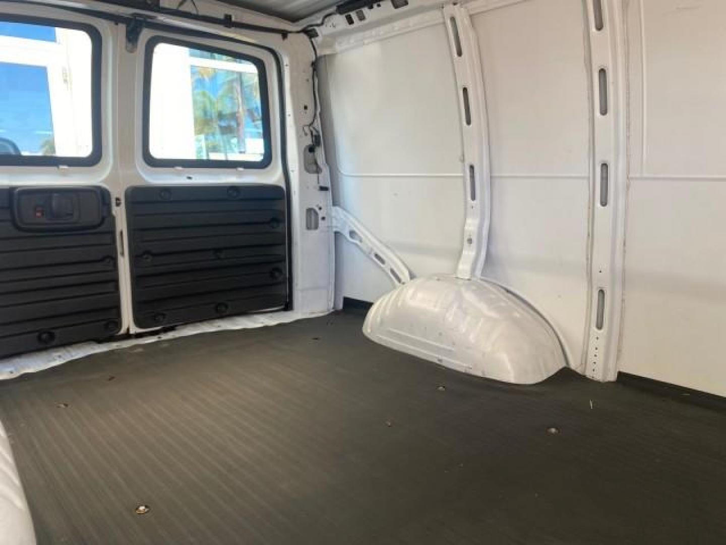 2004 Summit White /Medium Dark Pewter GMC Savana Cargo Van 1 OWNER FL (1GTFG15X141) with an 4.3L Vortec 4300 V6 MFI Engine engine, Automatic transmission, located at 4701 North Dixie Hwy, Pompano Beach, FL, 33064, (954) 422-2889, 26.240938, -80.123474 - OUR WEBPAGE FLORIDACARS1.COM HAS OVER 100 PHOTOS AND FREE CARFAX LINK 2004 GMC SAVANA 1500 THIS VAN IS LIKE NEW! VIN: 1GTFG15X141181482 1 G T F G 1 5 X 1 4 1 1 8 1 4 8 2 VAN 4.3L V6 F GASOLINE REAR WHEEL DRIVE Top Features Conversion Van Vinyl Seats Basic Features ABS Brakes AM/FM Stereo Air Conditi - Photo#95