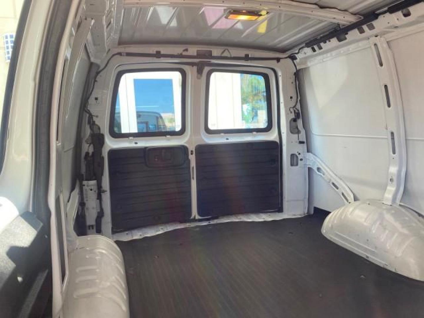 2004 Summit White /Medium Dark Pewter GMC Savana Cargo Van 1 OWNER FL (1GTFG15X141) with an 4.3L Vortec 4300 V6 MFI Engine engine, Automatic transmission, located at 4701 North Dixie Hwy, Pompano Beach, FL, 33064, (954) 422-2889, 26.240938, -80.123474 - OUR WEBPAGE FLORIDACARS1.COM HAS OVER 100 PHOTOS AND FREE CARFAX LINK 2004 GMC SAVANA 1500 THIS VAN IS LIKE NEW! VIN: 1GTFG15X141181482 1 G T F G 1 5 X 1 4 1 1 8 1 4 8 2 VAN 4.3L V6 F GASOLINE REAR WHEEL DRIVE Top Features Conversion Van Vinyl Seats Basic Features ABS Brakes AM/FM Stereo Air Conditi - Photo#97