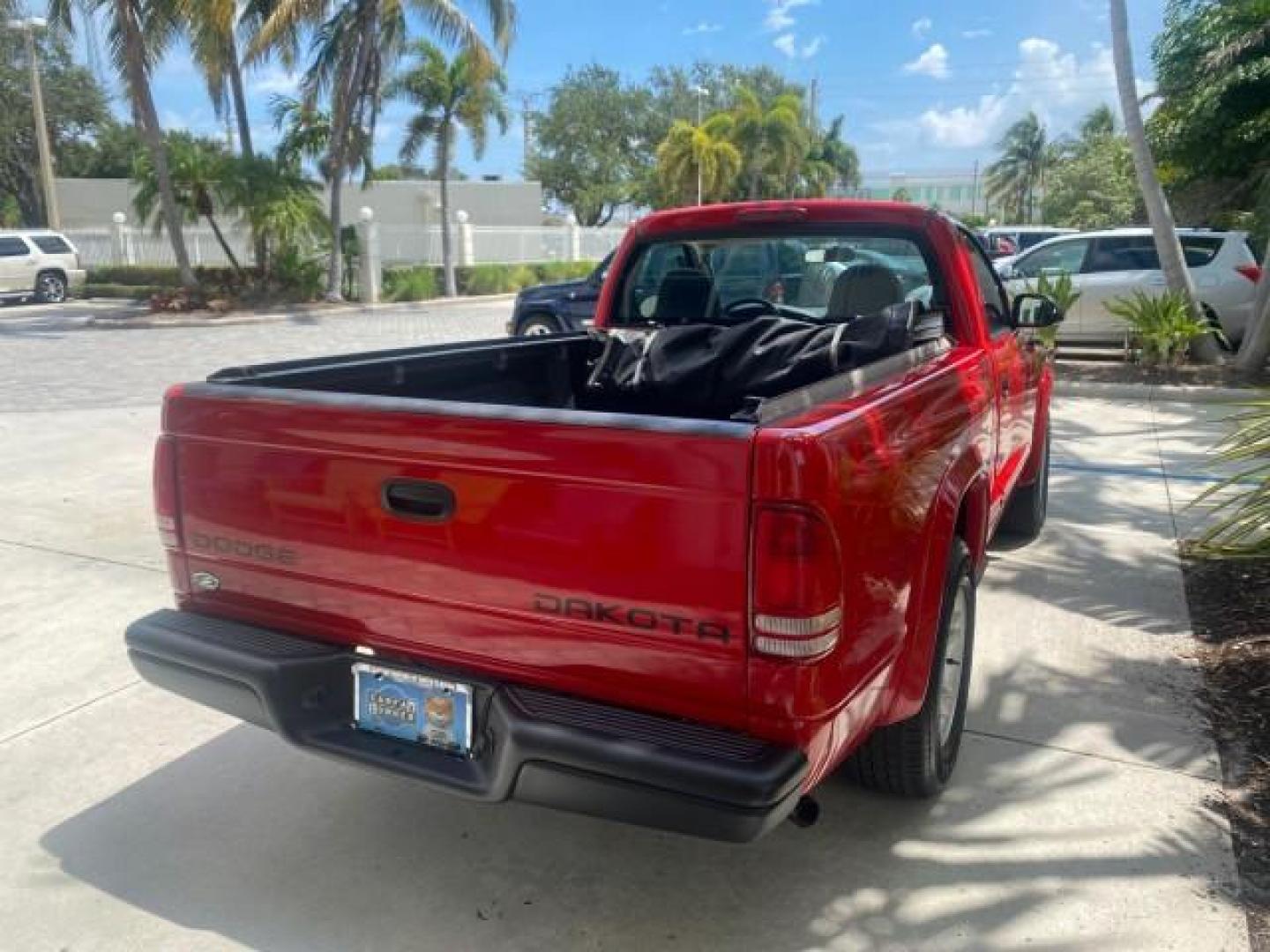 2004 Flame Red /Dark Slate Gray Dodge Dakota AC LOW MILES 25,008 (1D7FL16K04S) with an 3.7L SMPI V6 Magnum Engine engine, Automatic transmission, located at 4701 North Dixie Hwy, Pompano Beach, FL, 33064, (954) 422-2889, 26.240938, -80.123474 - OUR WEBPAGE FLORIDACARS1.COM HAS OVER 100 PHOTOS AND FREE CARFAX LINK 2004 DODGE DAKOTA VIN: 1D7FL16K04S664041 1 D 7 F L 1 6 K 0 4 S 6 6 4 0 4 1 PICKUP 3.7L V6 F GASOLINE REAR WHEEL DRIVE Top Features Alloy Wheels Bed Liner Cloth Seats Basic Features ABS Brakes AM/FM Stereo Air Conditioning Automati - Photo#63