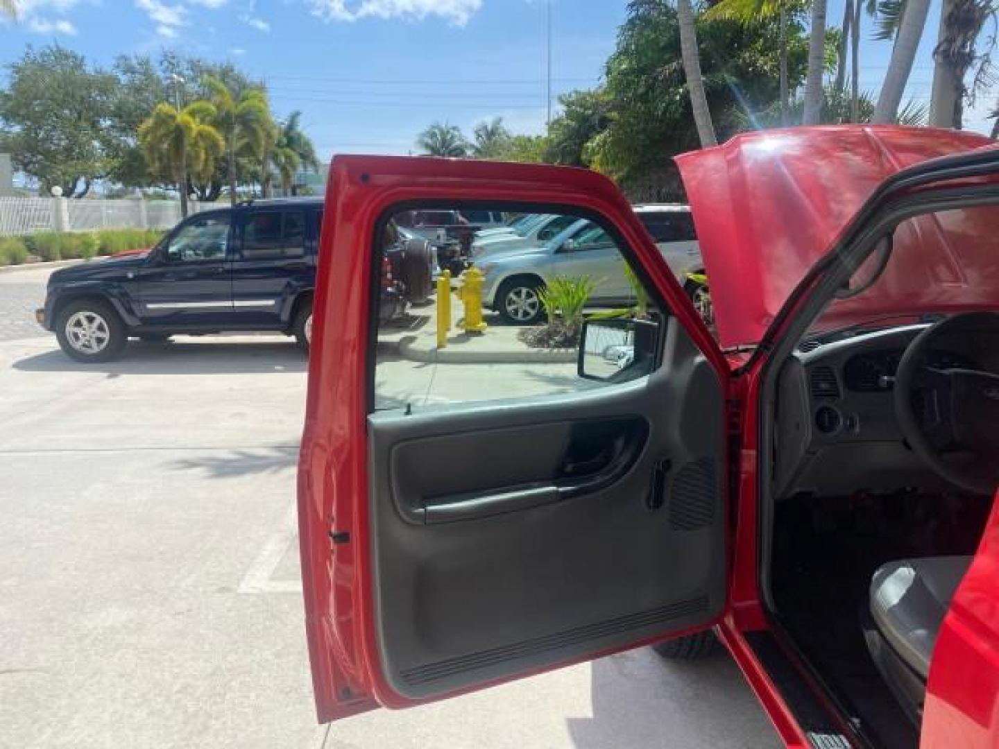 2010 Torch Red /Medium Dark Flint Ford Ranger XL LOW MILES 45,669 4 CYL 5 SPD (1FTKR1AD2AP) with an 2.3L DOHC 16-Valve I4 Engine engine, Manual transmission, located at 4701 North Dixie Hwy, Pompano Beach, FL, 33064, (954) 422-2889, 26.240938, -80.123474 - OUR WEBPAGE FLORIDACARS1.COM HAS OVER 100 PHOTOS AND FREE CARFAX LINK 2010 FORD RANGER XL VIN: 1FTKR1AD2APA10334 1 F T K R 1 A D 2 A P A 1 0 3 3 4 PICKUP 2.3L I4 F DOHC 16V GASOLINE REAR WHEEL DRIVE Features ABS Brakes Air Conditioning AM/FM Stereo Manual Transmission Side Airbags Tow Hitch Traction - Photo#9