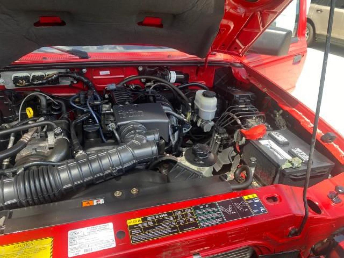 2010 Torch Red /Medium Dark Flint Ford Ranger XL LOW MILES 45,669 4 CYL 5 SPD (1FTKR1AD2AP) with an 2.3L DOHC 16-Valve I4 Engine engine, Manual transmission, located at 4701 North Dixie Hwy, Pompano Beach, FL, 33064, (954) 422-2889, 26.240938, -80.123474 - OUR WEBPAGE FLORIDACARS1.COM HAS OVER 100 PHOTOS AND FREE CARFAX LINK 2010 FORD RANGER XL VIN: 1FTKR1AD2APA10334 1 F T K R 1 A D 2 A P A 1 0 3 3 4 PICKUP 2.3L I4 F DOHC 16V GASOLINE REAR WHEEL DRIVE Features ABS Brakes Air Conditioning AM/FM Stereo Manual Transmission Side Airbags Tow Hitch Traction - Photo#25