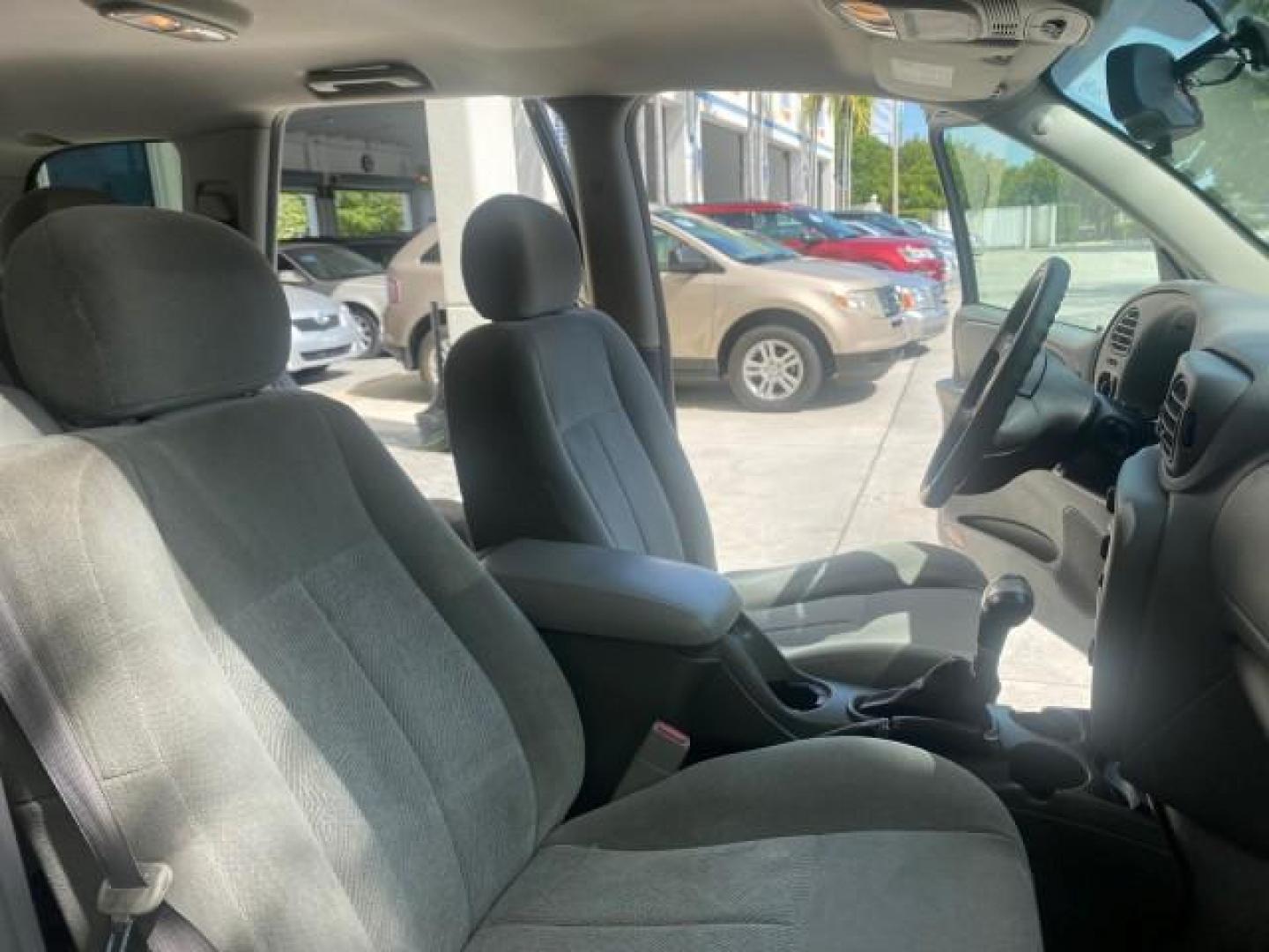 2005 Black /Light Gray Chevrolet TrailBlazer LT LOW MILES 30,654 (1GNDS13S752) with an 4.2L Vortec 4200 SFI I6 Engine engine, Automatic transmission, located at 4701 North Dixie Hwy, Pompano Beach, FL, 33064, (954) 422-2889, 26.240938, -80.123474 - OUR WEBPAGE FLORIDACARS1.COM HAS OVER 100 PHOTOS AND FREE CARFAX LINK 2005 CHEVROLET TRAILBLAZER LS VIN: 1GNDS13S752214856 4 DOOR WAGON/SPORT UTILITY 4.2L I6 F GASOLINE REAR WHEEL DRIVE Highlighted Features Alloy Wheels Automatic Climate Control Connected Car Cruise Control Dual-Zone Climate Control - Photo#12