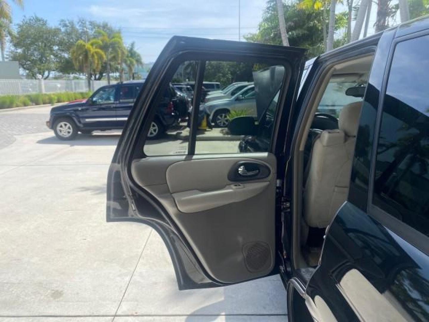 2005 Black /Light Gray Chevrolet TrailBlazer LT LOW MILES 30,654 (1GNDS13S752) with an 4.2L Vortec 4200 SFI I6 Engine engine, Automatic transmission, located at 4701 North Dixie Hwy, Pompano Beach, FL, 33064, (954) 422-2889, 26.240938, -80.123474 - OUR WEBPAGE FLORIDACARS1.COM HAS OVER 100 PHOTOS AND FREE CARFAX LINK 2005 CHEVROLET TRAILBLAZER LS VIN: 1GNDS13S752214856 4 DOOR WAGON/SPORT UTILITY 4.2L I6 F GASOLINE REAR WHEEL DRIVE Highlighted Features Alloy Wheels Automatic Climate Control Connected Car Cruise Control Dual-Zone Climate Control - Photo#13