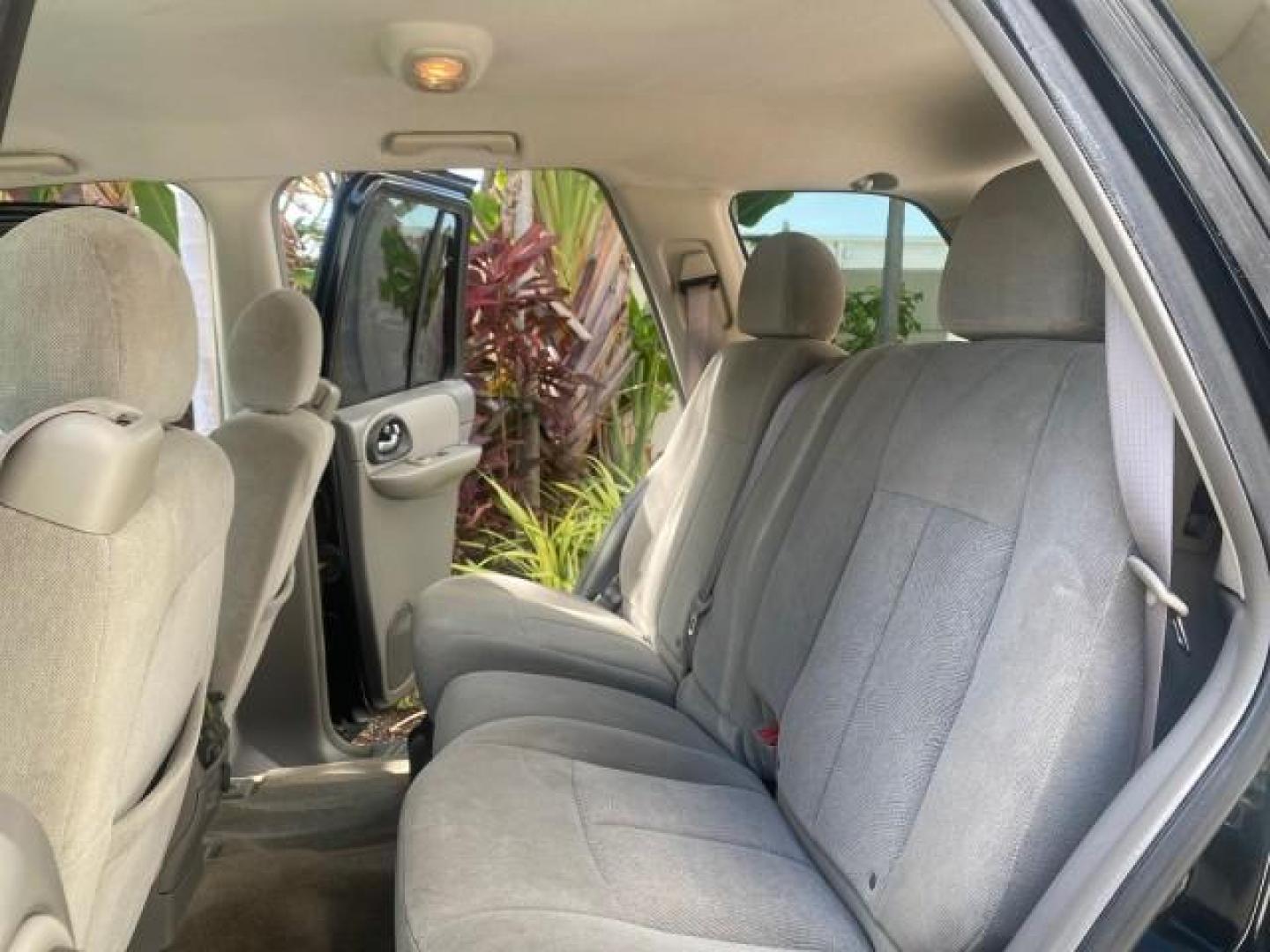 2005 Black /Light Gray Chevrolet TrailBlazer LT LOW MILES 30,654 (1GNDS13S752) with an 4.2L Vortec 4200 SFI I6 Engine engine, Automatic transmission, located at 4701 North Dixie Hwy, Pompano Beach, FL, 33064, (954) 422-2889, 26.240938, -80.123474 - OUR WEBPAGE FLORIDACARS1.COM HAS OVER 100 PHOTOS AND FREE CARFAX LINK 2005 CHEVROLET TRAILBLAZER LS VIN: 1GNDS13S752214856 4 DOOR WAGON/SPORT UTILITY 4.2L I6 F GASOLINE REAR WHEEL DRIVE Highlighted Features Alloy Wheels Automatic Climate Control Connected Car Cruise Control Dual-Zone Climate Control - Photo#14