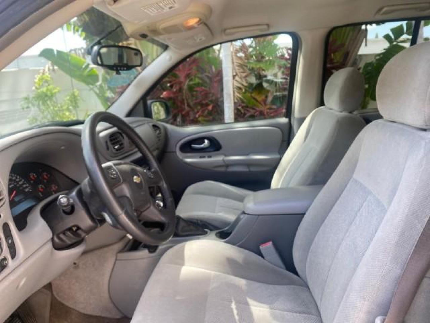 2005 Black /Light Gray Chevrolet TrailBlazer LT LOW MILES 30,654 (1GNDS13S752) with an 4.2L Vortec 4200 SFI I6 Engine engine, Automatic transmission, located at 4701 North Dixie Hwy, Pompano Beach, FL, 33064, (954) 422-2889, 26.240938, -80.123474 - OUR WEBPAGE FLORIDACARS1.COM HAS OVER 100 PHOTOS AND FREE CARFAX LINK 2005 CHEVROLET TRAILBLAZER LS VIN: 1GNDS13S752214856 4 DOOR WAGON/SPORT UTILITY 4.2L I6 F GASOLINE REAR WHEEL DRIVE Highlighted Features Alloy Wheels Automatic Climate Control Connected Car Cruise Control Dual-Zone Climate Control - Photo#33