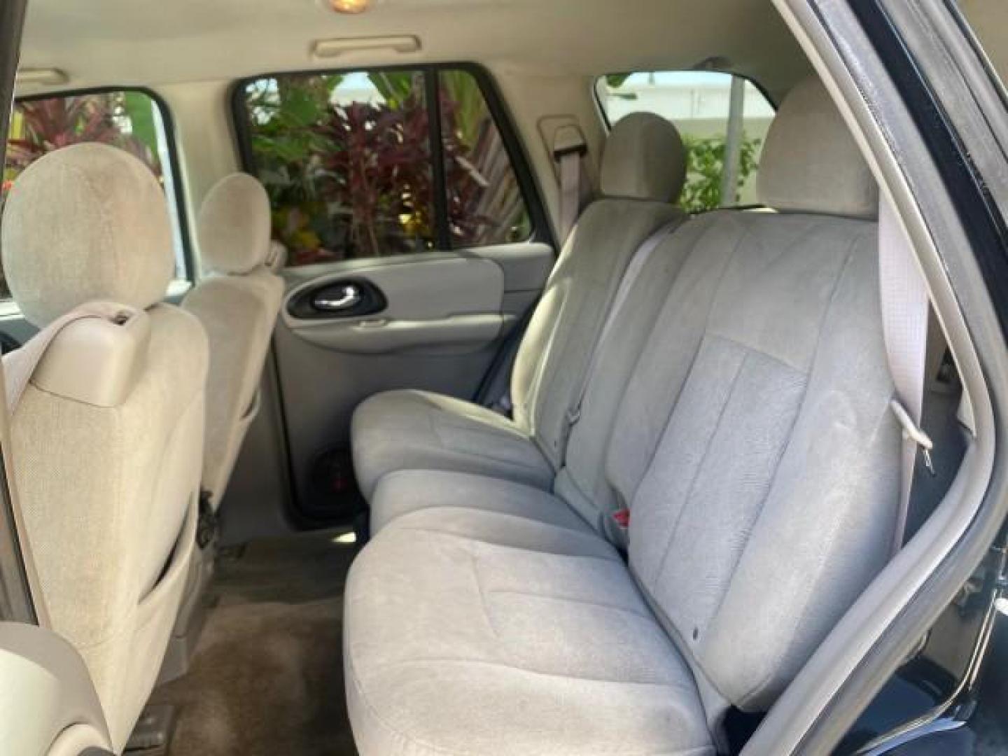 2005 Black /Light Gray Chevrolet TrailBlazer LT LOW MILES 30,654 (1GNDS13S752) with an 4.2L Vortec 4200 SFI I6 Engine engine, Automatic transmission, located at 4701 North Dixie Hwy, Pompano Beach, FL, 33064, (954) 422-2889, 26.240938, -80.123474 - OUR WEBPAGE FLORIDACARS1.COM HAS OVER 100 PHOTOS AND FREE CARFAX LINK 2005 CHEVROLET TRAILBLAZER LS VIN: 1GNDS13S752214856 4 DOOR WAGON/SPORT UTILITY 4.2L I6 F GASOLINE REAR WHEEL DRIVE Highlighted Features Alloy Wheels Automatic Climate Control Connected Car Cruise Control Dual-Zone Climate Control - Photo#60