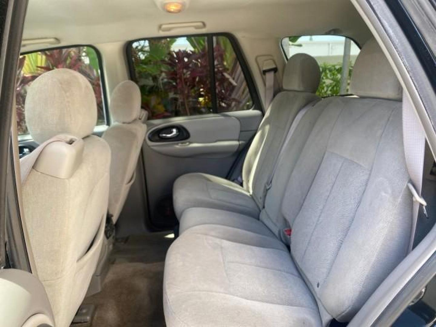 2005 Black /Light Gray Chevrolet TrailBlazer LT LOW MILES 30,654 (1GNDS13S752) with an 4.2L Vortec 4200 SFI I6 Engine engine, Automatic transmission, located at 4701 North Dixie Hwy, Pompano Beach, FL, 33064, (954) 422-2889, 26.240938, -80.123474 - OUR WEBPAGE FLORIDACARS1.COM HAS OVER 100 PHOTOS AND FREE CARFAX LINK 2005 CHEVROLET TRAILBLAZER LS VIN: 1GNDS13S752214856 4 DOOR WAGON/SPORT UTILITY 4.2L I6 F GASOLINE REAR WHEEL DRIVE Highlighted Features Alloy Wheels Automatic Climate Control Connected Car Cruise Control Dual-Zone Climate Control - Photo#61