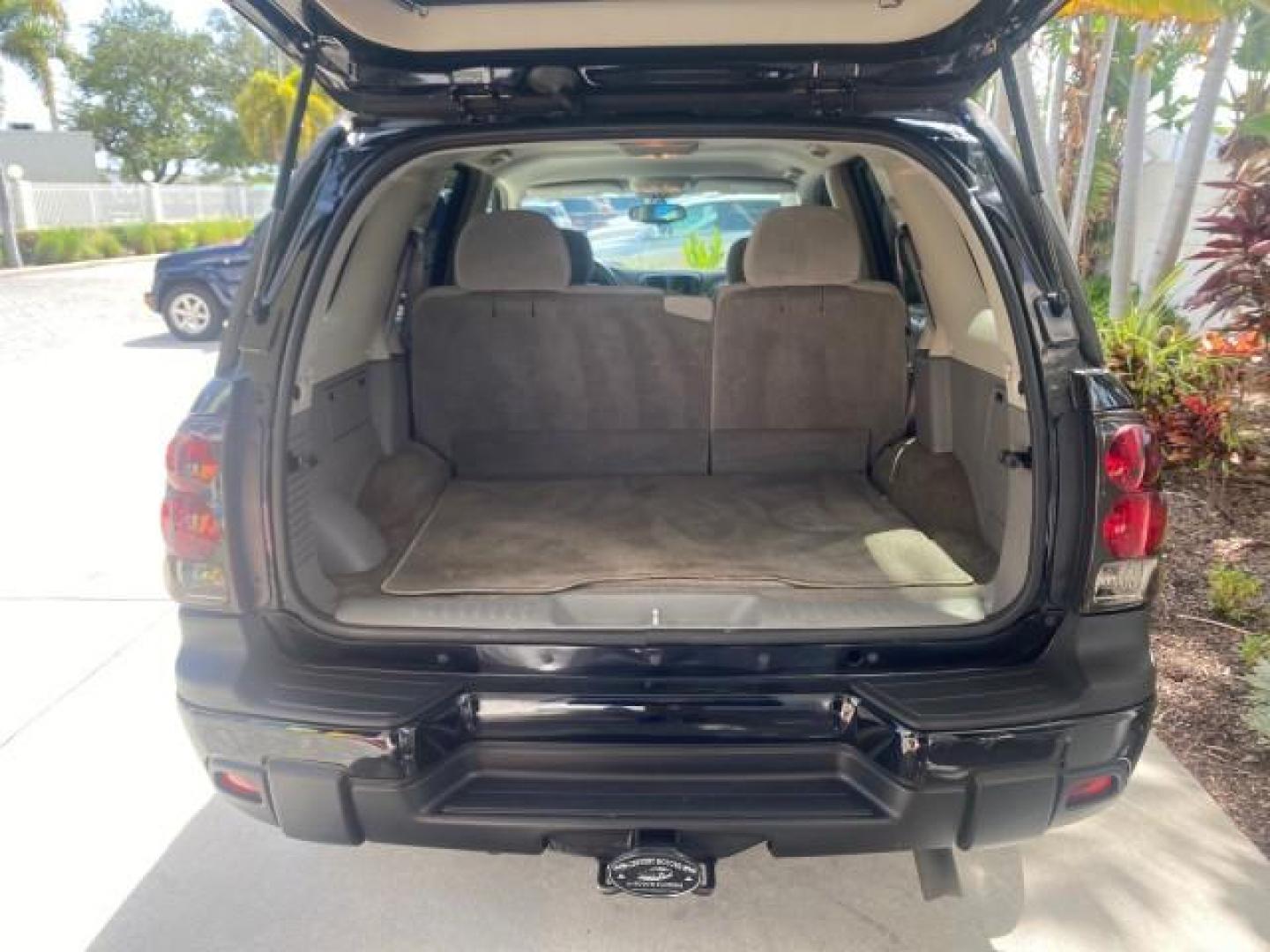 2005 Black /Light Gray Chevrolet TrailBlazer LT LOW MILES 30,654 (1GNDS13S752) with an 4.2L Vortec 4200 SFI I6 Engine engine, Automatic transmission, located at 4701 North Dixie Hwy, Pompano Beach, FL, 33064, (954) 422-2889, 26.240938, -80.123474 - OUR WEBPAGE FLORIDACARS1.COM HAS OVER 100 PHOTOS AND FREE CARFAX LINK 2005 CHEVROLET TRAILBLAZER LS VIN: 1GNDS13S752214856 4 DOOR WAGON/SPORT UTILITY 4.2L I6 F GASOLINE REAR WHEEL DRIVE Highlighted Features Alloy Wheels Automatic Climate Control Connected Car Cruise Control Dual-Zone Climate Control - Photo#80