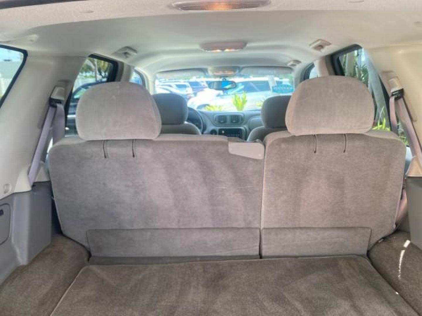 2005 Black /Light Gray Chevrolet TrailBlazer LT LOW MILES 30,654 (1GNDS13S752) with an 4.2L Vortec 4200 SFI I6 Engine engine, Automatic transmission, located at 4701 North Dixie Hwy, Pompano Beach, FL, 33064, (954) 422-2889, 26.240938, -80.123474 - OUR WEBPAGE FLORIDACARS1.COM HAS OVER 100 PHOTOS AND FREE CARFAX LINK 2005 CHEVROLET TRAILBLAZER LS VIN: 1GNDS13S752214856 4 DOOR WAGON/SPORT UTILITY 4.2L I6 F GASOLINE REAR WHEEL DRIVE Highlighted Features Alloy Wheels Automatic Climate Control Connected Car Cruise Control Dual-Zone Climate Control - Photo#82