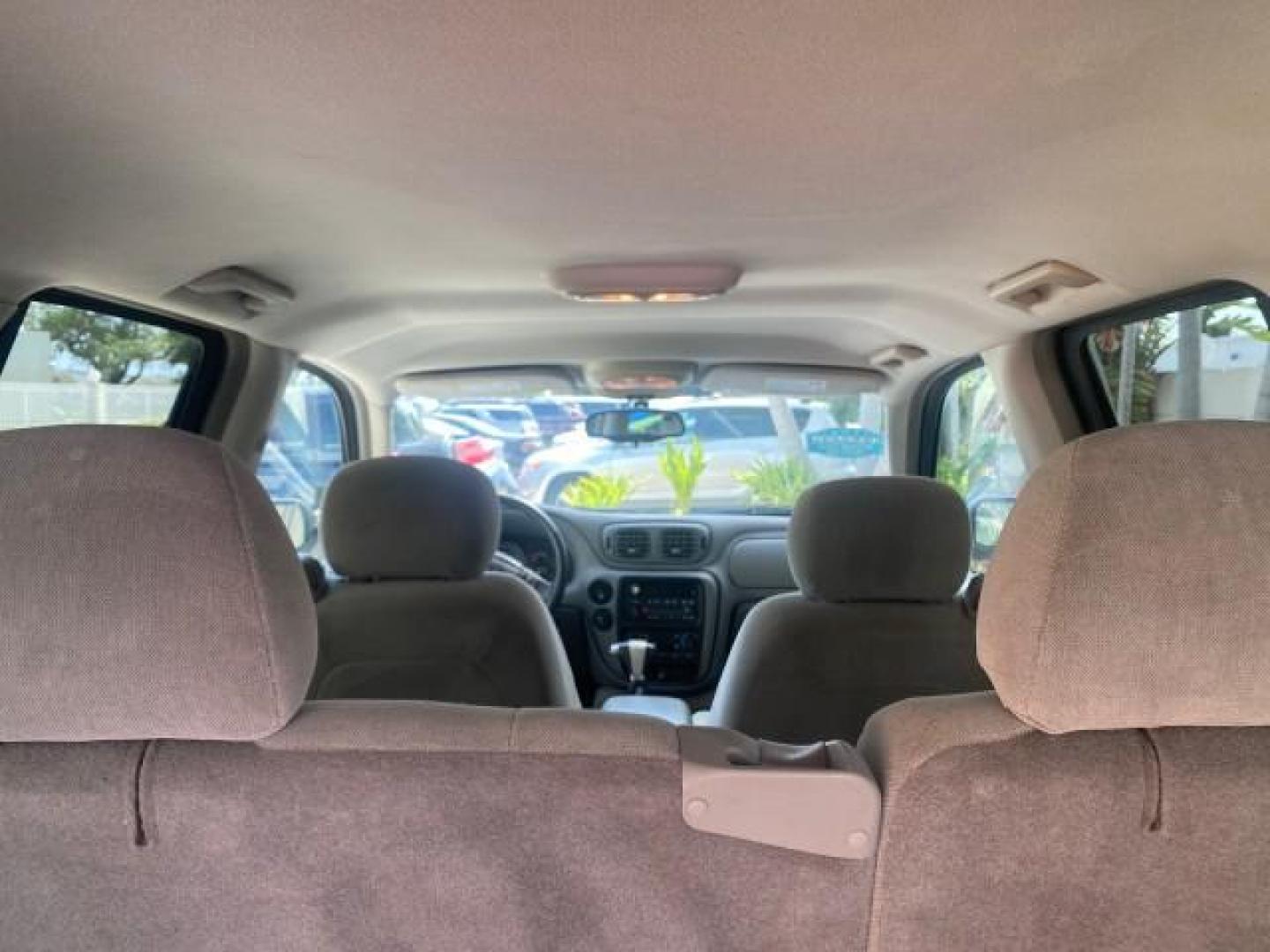 2005 Black /Light Gray Chevrolet TrailBlazer LT LOW MILES 30,654 (1GNDS13S752) with an 4.2L Vortec 4200 SFI I6 Engine engine, Automatic transmission, located at 4701 North Dixie Hwy, Pompano Beach, FL, 33064, (954) 422-2889, 26.240938, -80.123474 - OUR WEBPAGE FLORIDACARS1.COM HAS OVER 100 PHOTOS AND FREE CARFAX LINK 2005 CHEVROLET TRAILBLAZER LS VIN: 1GNDS13S752214856 4 DOOR WAGON/SPORT UTILITY 4.2L I6 F GASOLINE REAR WHEEL DRIVE Highlighted Features Alloy Wheels Automatic Climate Control Connected Car Cruise Control Dual-Zone Climate Control - Photo#83