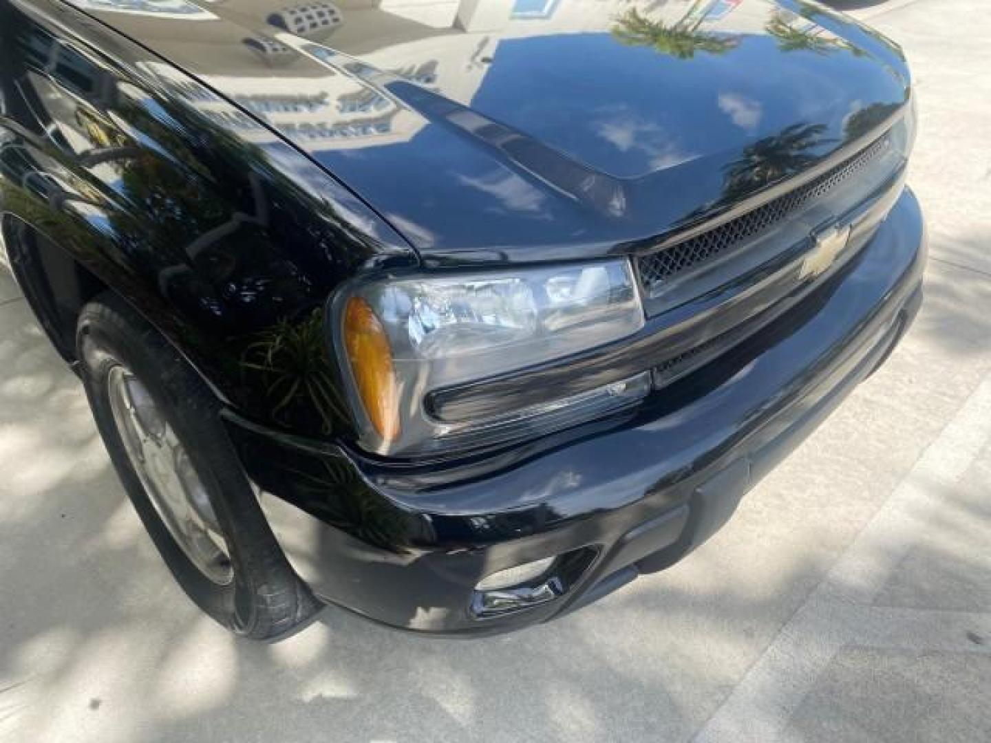 2005 Black /Light Gray Chevrolet TrailBlazer LT LOW MILES 30,654 (1GNDS13S752) with an 4.2L Vortec 4200 SFI I6 Engine engine, Automatic transmission, located at 4701 North Dixie Hwy, Pompano Beach, FL, 33064, (954) 422-2889, 26.240938, -80.123474 - OUR WEBPAGE FLORIDACARS1.COM HAS OVER 100 PHOTOS AND FREE CARFAX LINK 2005 CHEVROLET TRAILBLAZER LS VIN: 1GNDS13S752214856 4 DOOR WAGON/SPORT UTILITY 4.2L I6 F GASOLINE REAR WHEEL DRIVE Highlighted Features Alloy Wheels Automatic Climate Control Connected Car Cruise Control Dual-Zone Climate Control - Photo#85