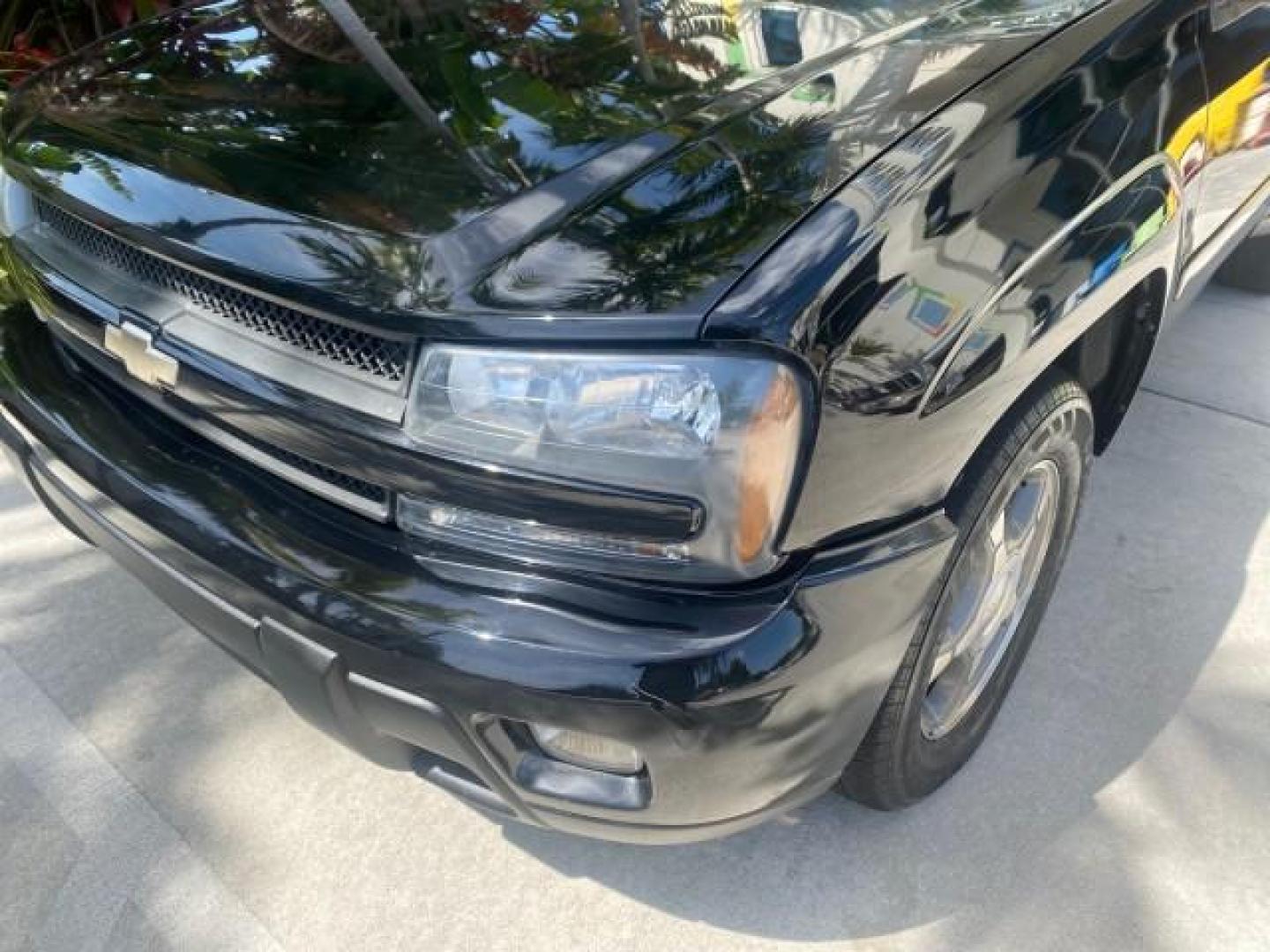 2005 Black /Light Gray Chevrolet TrailBlazer LT LOW MILES 30,654 (1GNDS13S752) with an 4.2L Vortec 4200 SFI I6 Engine engine, Automatic transmission, located at 4701 North Dixie Hwy, Pompano Beach, FL, 33064, (954) 422-2889, 26.240938, -80.123474 - OUR WEBPAGE FLORIDACARS1.COM HAS OVER 100 PHOTOS AND FREE CARFAX LINK 2005 CHEVROLET TRAILBLAZER LS VIN: 1GNDS13S752214856 4 DOOR WAGON/SPORT UTILITY 4.2L I6 F GASOLINE REAR WHEEL DRIVE Highlighted Features Alloy Wheels Automatic Climate Control Connected Car Cruise Control Dual-Zone Climate Control - Photo#88