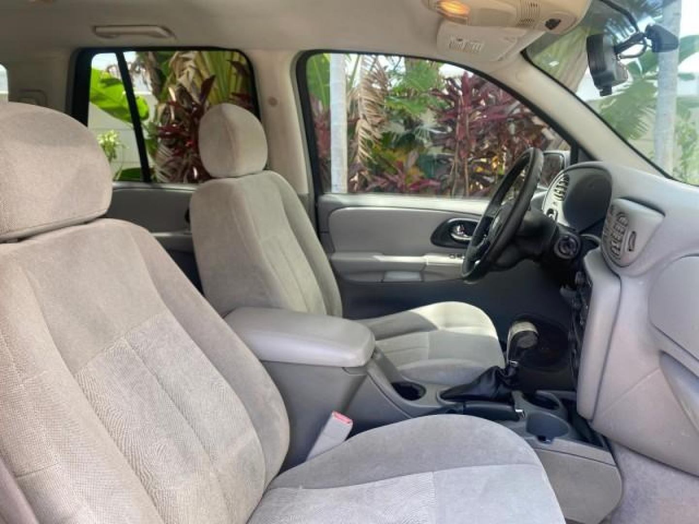 2005 Black /Light Gray Chevrolet TrailBlazer LT LOW MILES 30,654 (1GNDS13S752) with an 4.2L Vortec 4200 SFI I6 Engine engine, Automatic transmission, located at 4701 North Dixie Hwy, Pompano Beach, FL, 33064, (954) 422-2889, 26.240938, -80.123474 - OUR WEBPAGE FLORIDACARS1.COM HAS OVER 100 PHOTOS AND FREE CARFAX LINK 2005 CHEVROLET TRAILBLAZER LS VIN: 1GNDS13S752214856 4 DOOR WAGON/SPORT UTILITY 4.2L I6 F GASOLINE REAR WHEEL DRIVE Highlighted Features Alloy Wheels Automatic Climate Control Connected Car Cruise Control Dual-Zone Climate Control - Photo#98