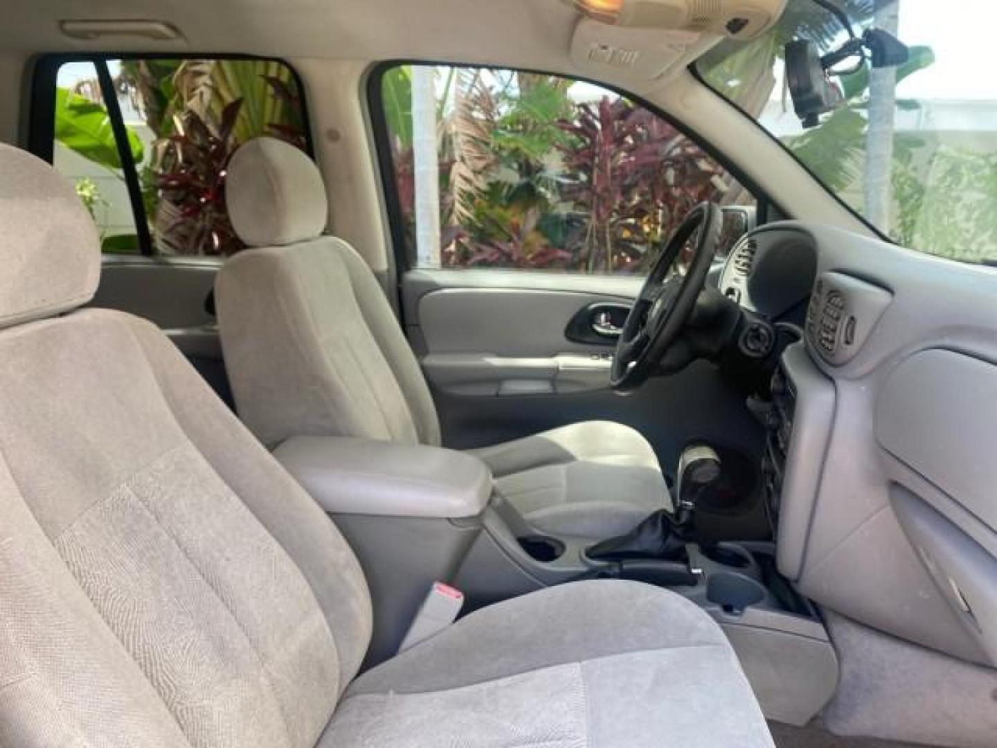 2005 Black /Light Gray Chevrolet TrailBlazer LT LOW MILES 30,654 (1GNDS13S752) with an 4.2L Vortec 4200 SFI I6 Engine engine, Automatic transmission, located at 4701 North Dixie Hwy, Pompano Beach, FL, 33064, (954) 422-2889, 26.240938, -80.123474 - OUR WEBPAGE FLORIDACARS1.COM HAS OVER 100 PHOTOS AND FREE CARFAX LINK 2005 CHEVROLET TRAILBLAZER LS VIN: 1GNDS13S752214856 4 DOOR WAGON/SPORT UTILITY 4.2L I6 F GASOLINE REAR WHEEL DRIVE Highlighted Features Alloy Wheels Automatic Climate Control Connected Car Cruise Control Dual-Zone Climate Control - Photo#99
