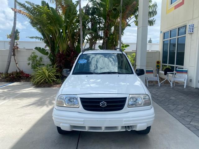 2001 Bright White /Gray Suzuki Vitara JLS LOW 35,130 1 OWNER (2S3TE52V716) with an 2.0L DOHC MPFI 16-Valve 4-Cyl Engine engine, Automatic transmission, located at 4701 North Dixie Hwy, Pompano Beach, FL, 33064, (954) 422-2889, 26.240938, -80.123474 - OUR WEBPAGE FLORIDACARS1.COM HAS OVER 100 PHOTOS AND FREE CARFAX LINK 2001 SUZUKI VITARA JLS VIN: 2S3TE52V716105780 2 S 3 T E 5 2 V 7 1 6 1 0 5 7 8 0 4 DOOR WAGON/SPORT UTILITY 2.0L I4 F DOHC 16V GASOLINE REAR WHEEL DRIVE Top Features Cloth Seats Soft Top Basic Features AM/FM Stereo Air Conditioning - Photo#2