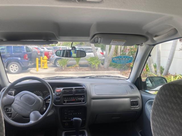 2001 Bright White /Gray Suzuki Vitara JLS LOW 35,130 1 OWNER (2S3TE52V716) with an 2.0L DOHC MPFI 16-Valve 4-Cyl Engine engine, Automatic transmission, located at 4701 North Dixie Hwy, Pompano Beach, FL, 33064, (954) 422-2889, 26.240938, -80.123474 - OUR WEBPAGE FLORIDACARS1.COM HAS OVER 100 PHOTOS AND FREE CARFAX LINK 2001 SUZUKI VITARA JLS VIN: 2S3TE52V716105780 2 S 3 T E 5 2 V 7 1 6 1 0 5 7 8 0 4 DOOR WAGON/SPORT UTILITY 2.0L I4 F DOHC 16V GASOLINE REAR WHEEL DRIVE Top Features Cloth Seats Soft Top Basic Features AM/FM Stereo Air Conditioning - Photo#67