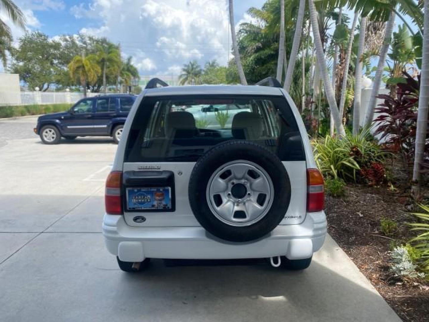 2001 Bright White /Gray Suzuki Vitara JLS LOW 35,130 1 OWNER (2S3TE52V716) with an 2.0L DOHC MPFI 16-Valve 4-Cyl Engine engine, Automatic transmission, located at 4701 North Dixie Hwy, Pompano Beach, FL, 33064, (954) 422-2889, 26.240938, -80.123474 - OUR WEBPAGE FLORIDACARS1.COM HAS OVER 100 PHOTOS AND FREE CARFAX LINK 2001 SUZUKI VITARA JLS VIN: 2S3TE52V716105780 2 S 3 T E 5 2 V 7 1 6 1 0 5 7 8 0 4 DOOR WAGON/SPORT UTILITY 2.0L I4 F DOHC 16V GASOLINE REAR WHEEL DRIVE Top Features Cloth Seats Soft Top Basic Features AM/FM Stereo Air Conditioning - Photo#72